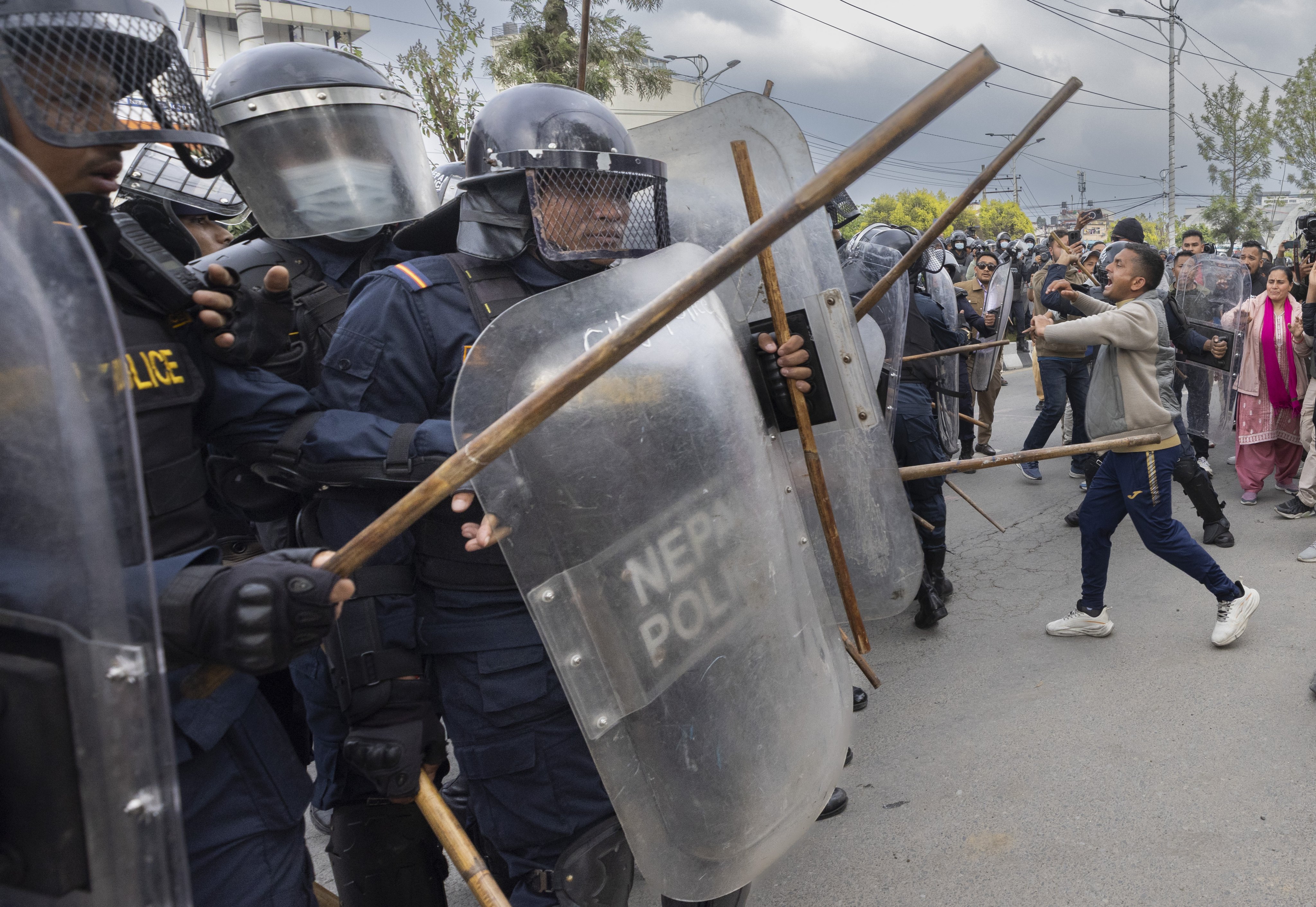 Police clash with activists during a protest against the arrest of former prime minister K.P. Sharma Oli in Kathmandu, Nepal, on March 29. Photo: EPA