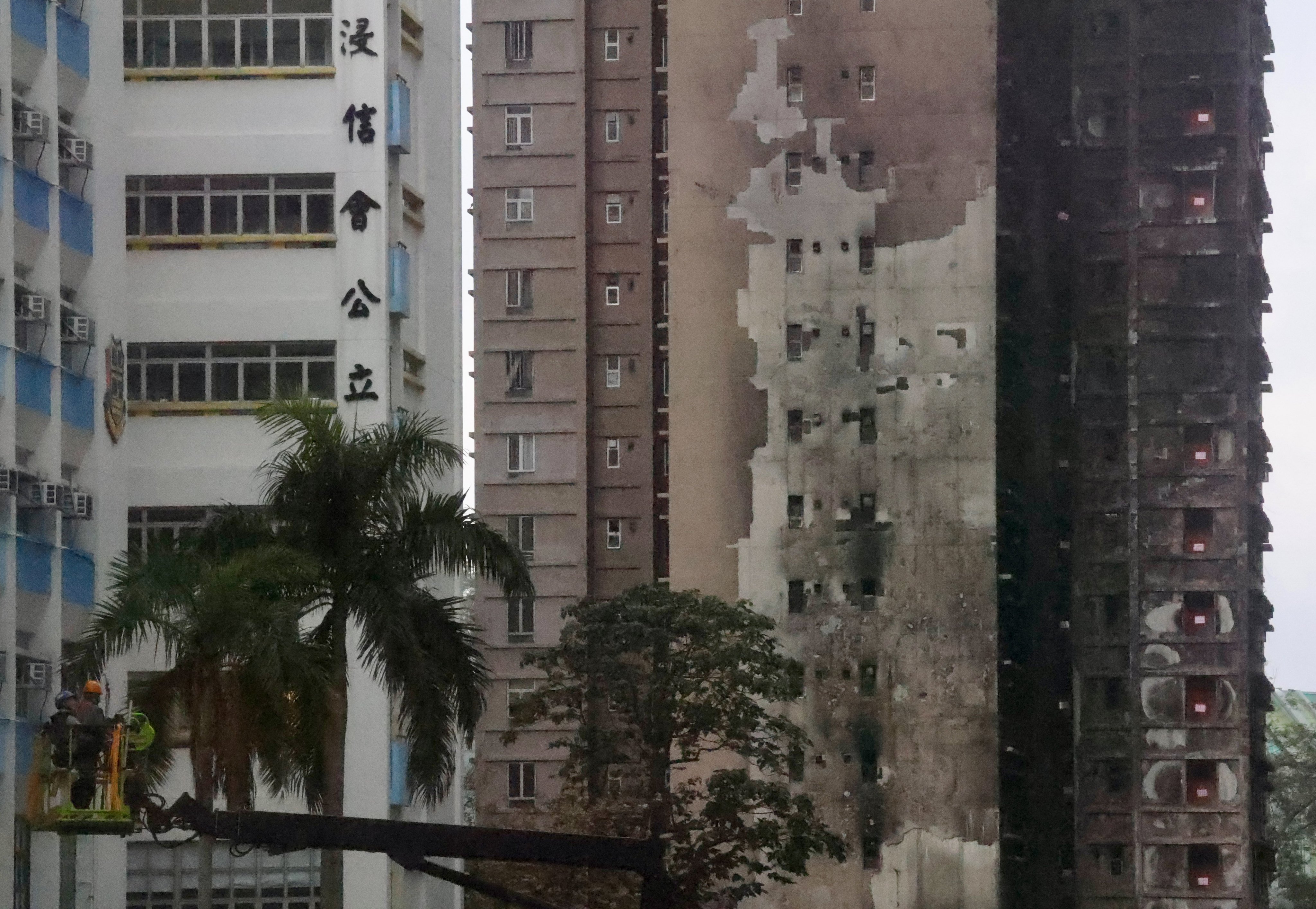 The damaged buildings of Wang Fuk Court (right) in Tai Po are seen on March 27. The Competition Commission has launched proceedings targeting  alleged corruption and anti-competitive practices in the bids for several projects, including one linked to the Wang Fuk Court inferno. Photo: Jonathan Wong