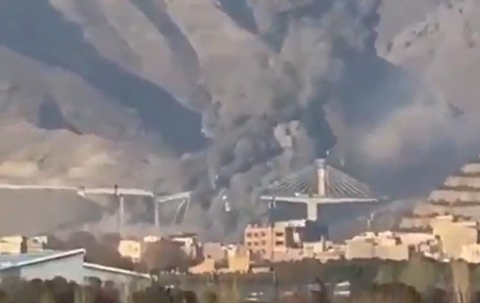 Smoke rises from Iran’s B1 bridge after a US-Israeli strike. Photo: Donald Trump via Truth Social