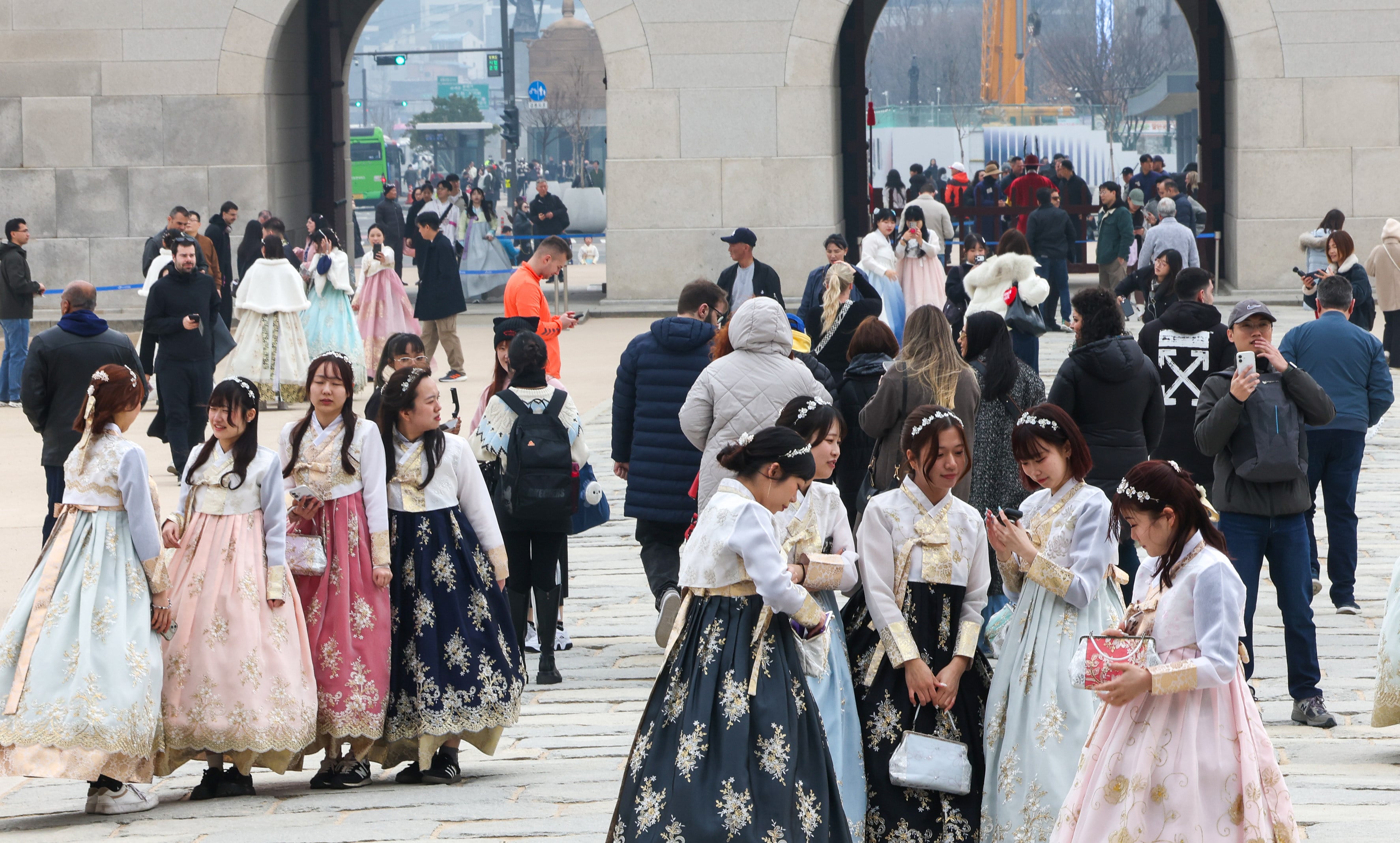 Tourists walk around Gyeongbok Palace in central Seoul, South Korea, on March 15. Photo: EPA