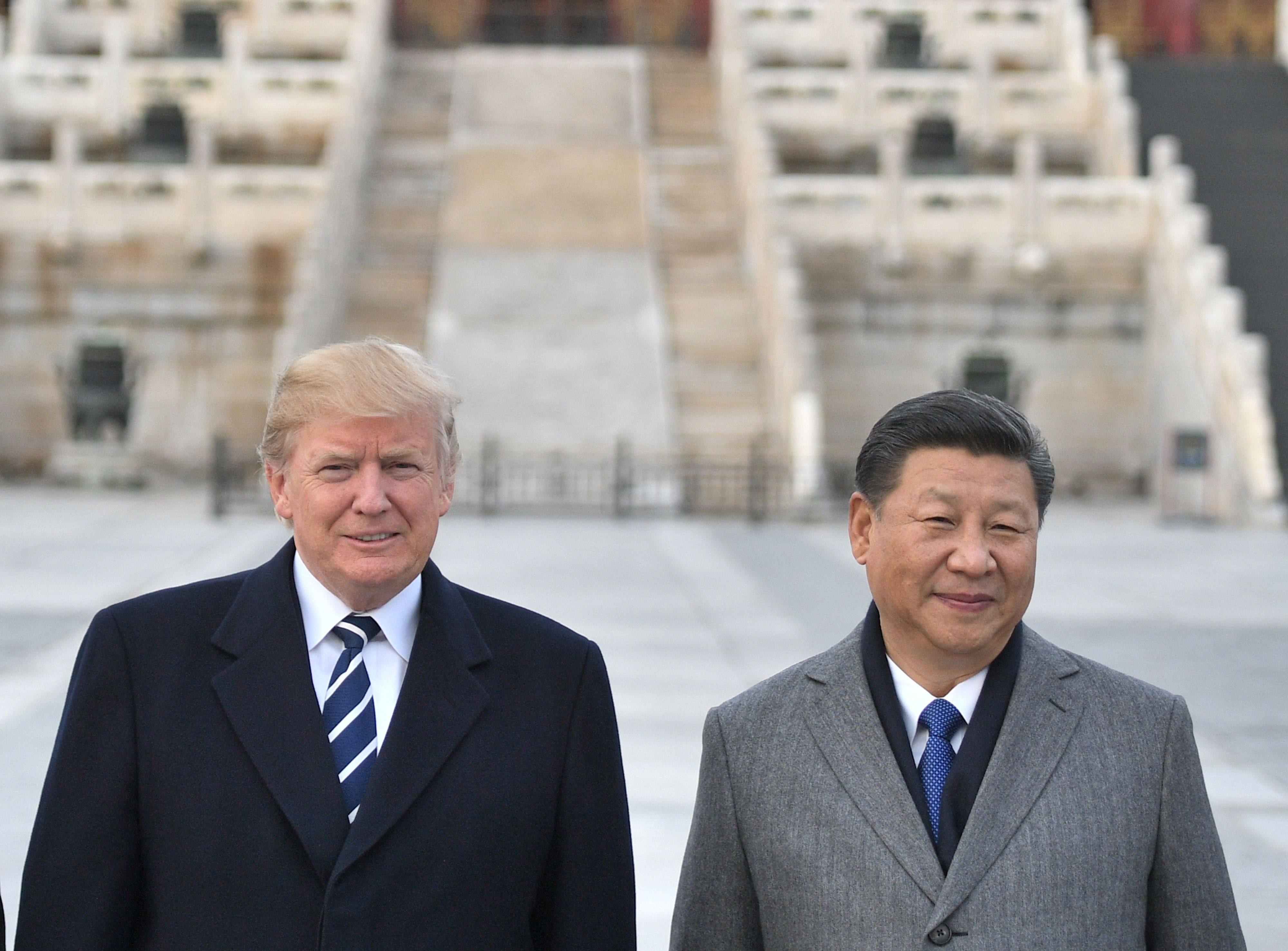 US President Donald Trump, left, and President Xi Jinping pose for a photo at the Forbidden City in Beijing on November 8, 2017. Photo: AFP