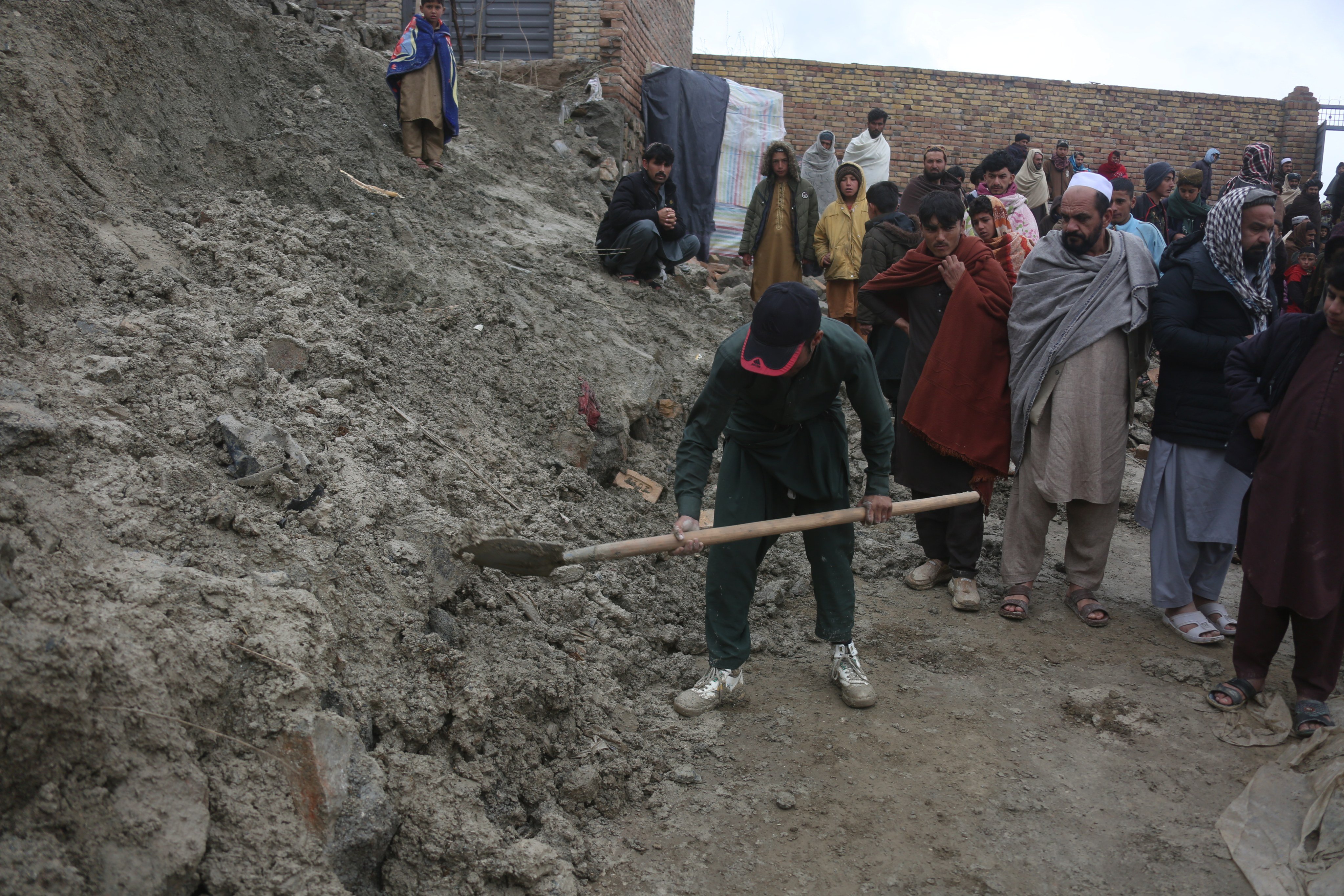 A man digs in the ruins of a building after a fatal earthquake in Kabul province, Afghanistan, on Saturday. Photo: Xinhua