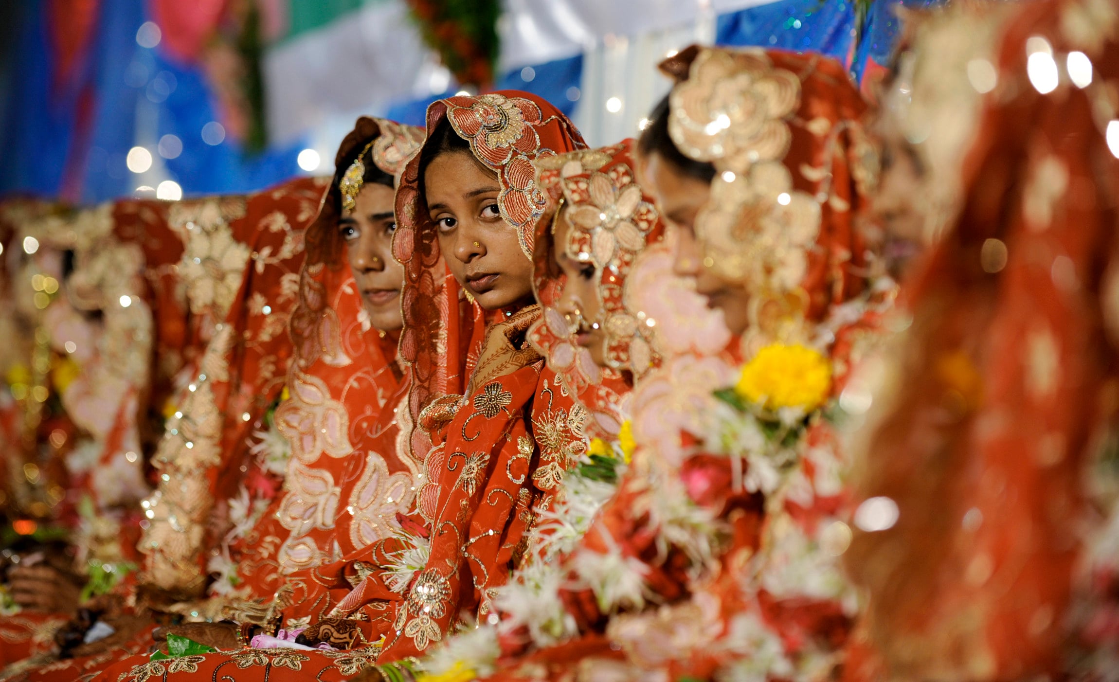Brides sit during a mass marriage ceremony in Mumbai. Photo: AFP