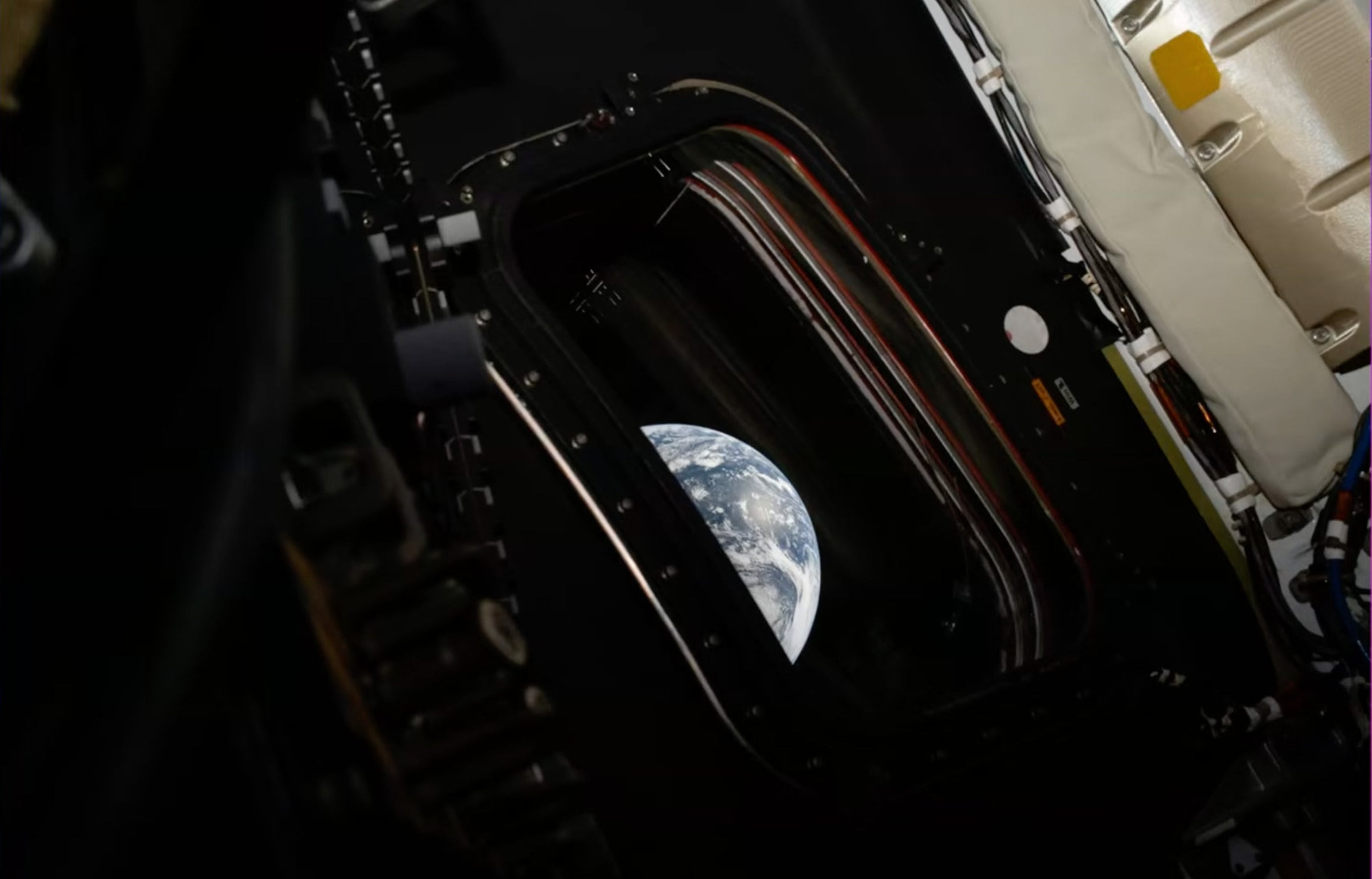 Earth is seen from inside the Orion capsule in an image released by Nasa on Friday.  Photo: Nasa via AP