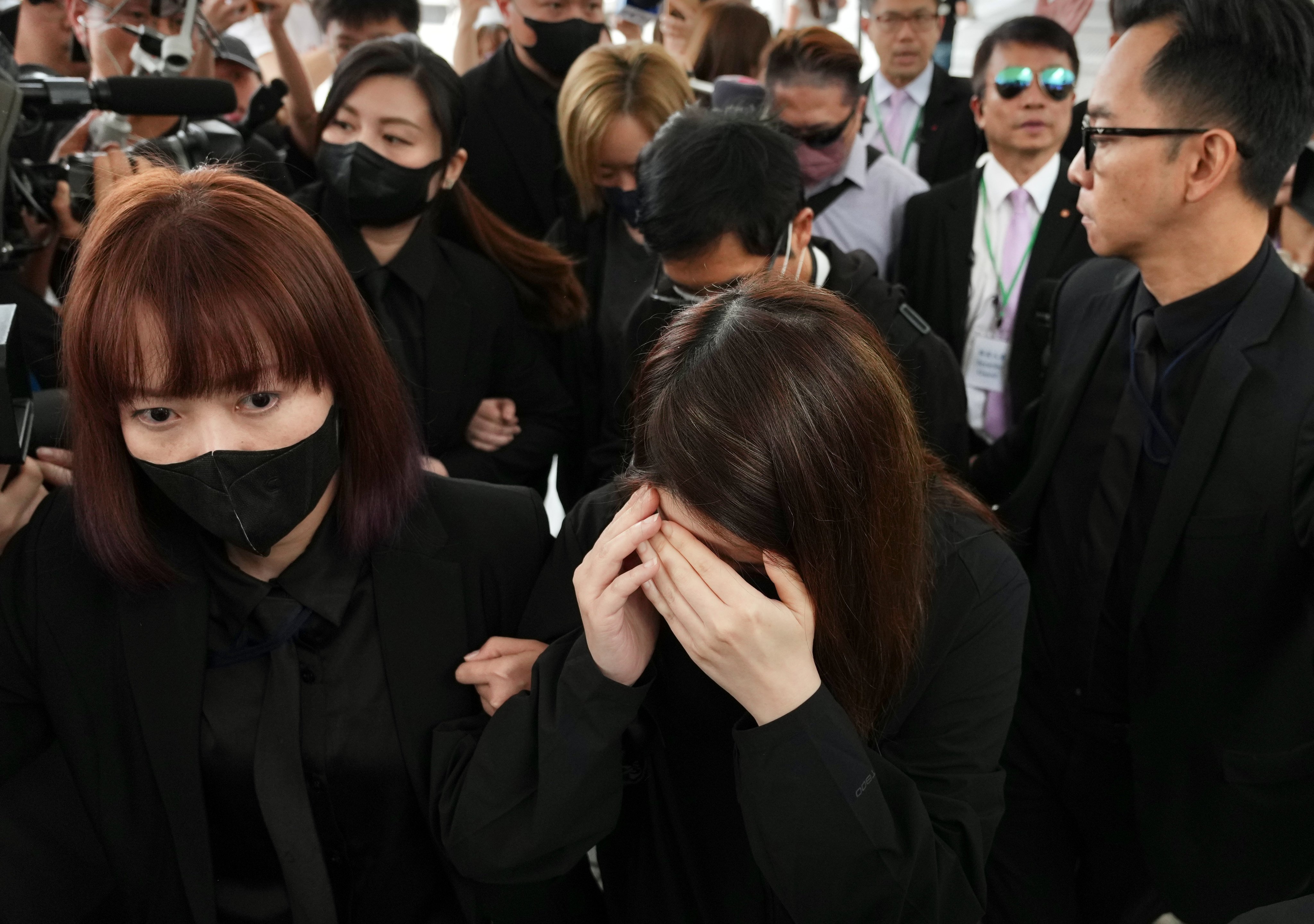 Witnesses from ISS EastPoint Properties leave the City Gallery in Central following the morning session of the Wang Fuk Court fire hearing on April 1. Photo: Karma Lo
