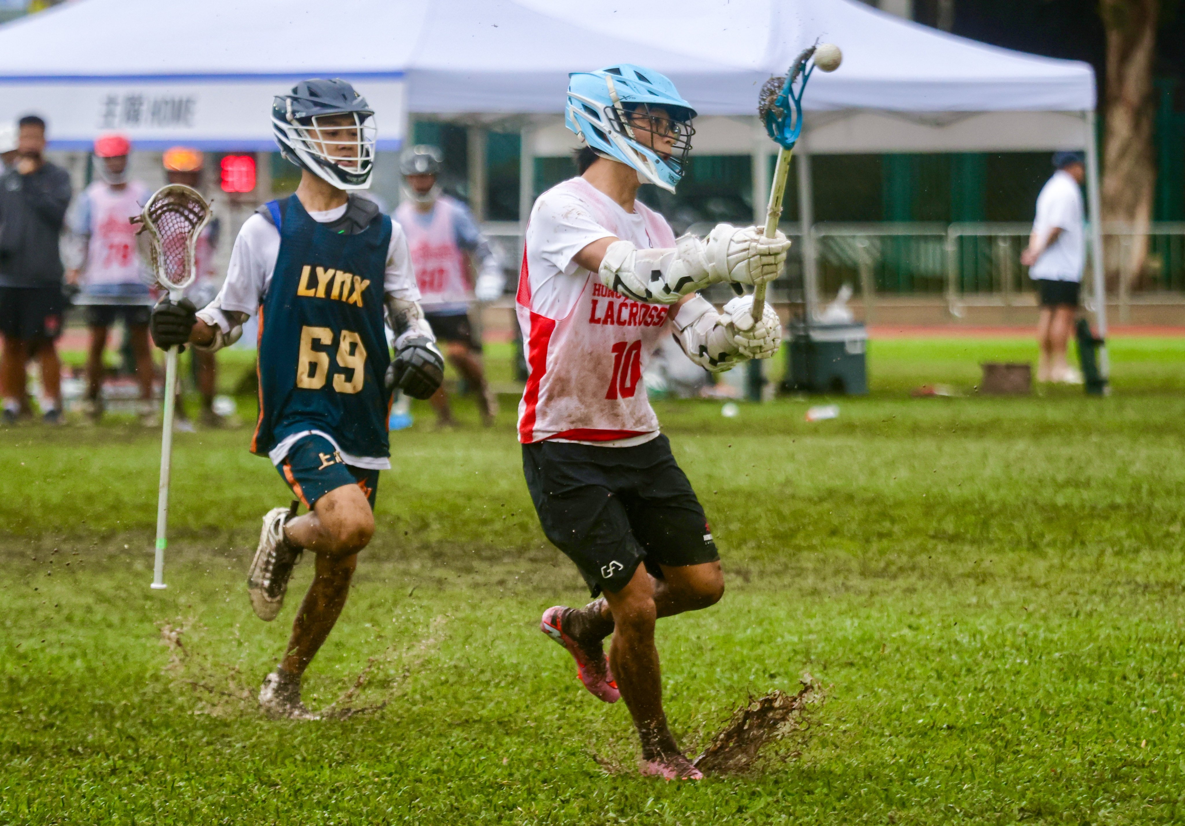 Hong Kong’s Tong Yat-yu (right) takes the ball during his side’s under-16 boys clash with Shanghai Lynx. Photo: Jonathan Wong