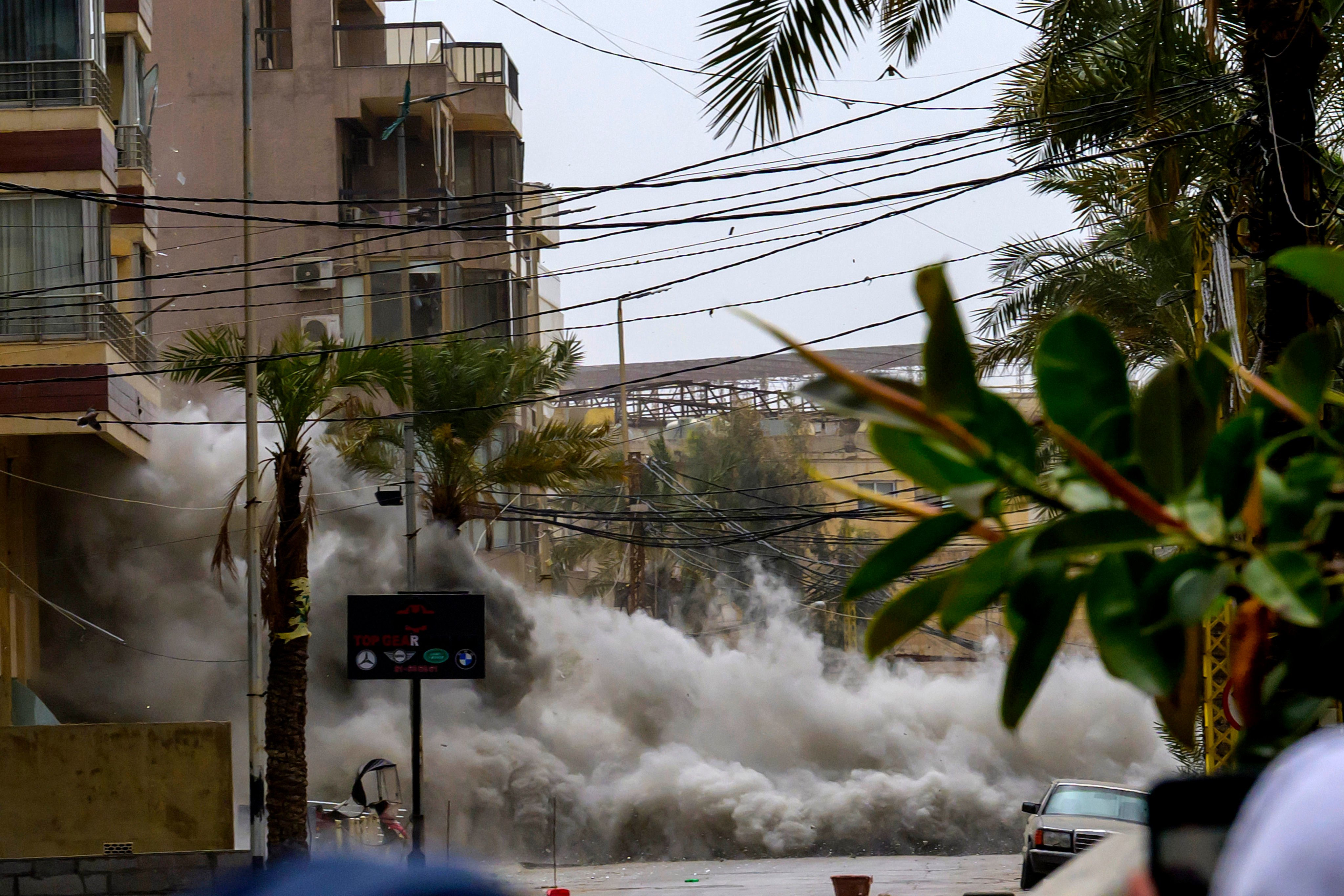 Smoke and dust from an Israeli airstrike on the streets of the southern suburbs of Beirut, Lebanon, on Sunday. Photo: Xinhua