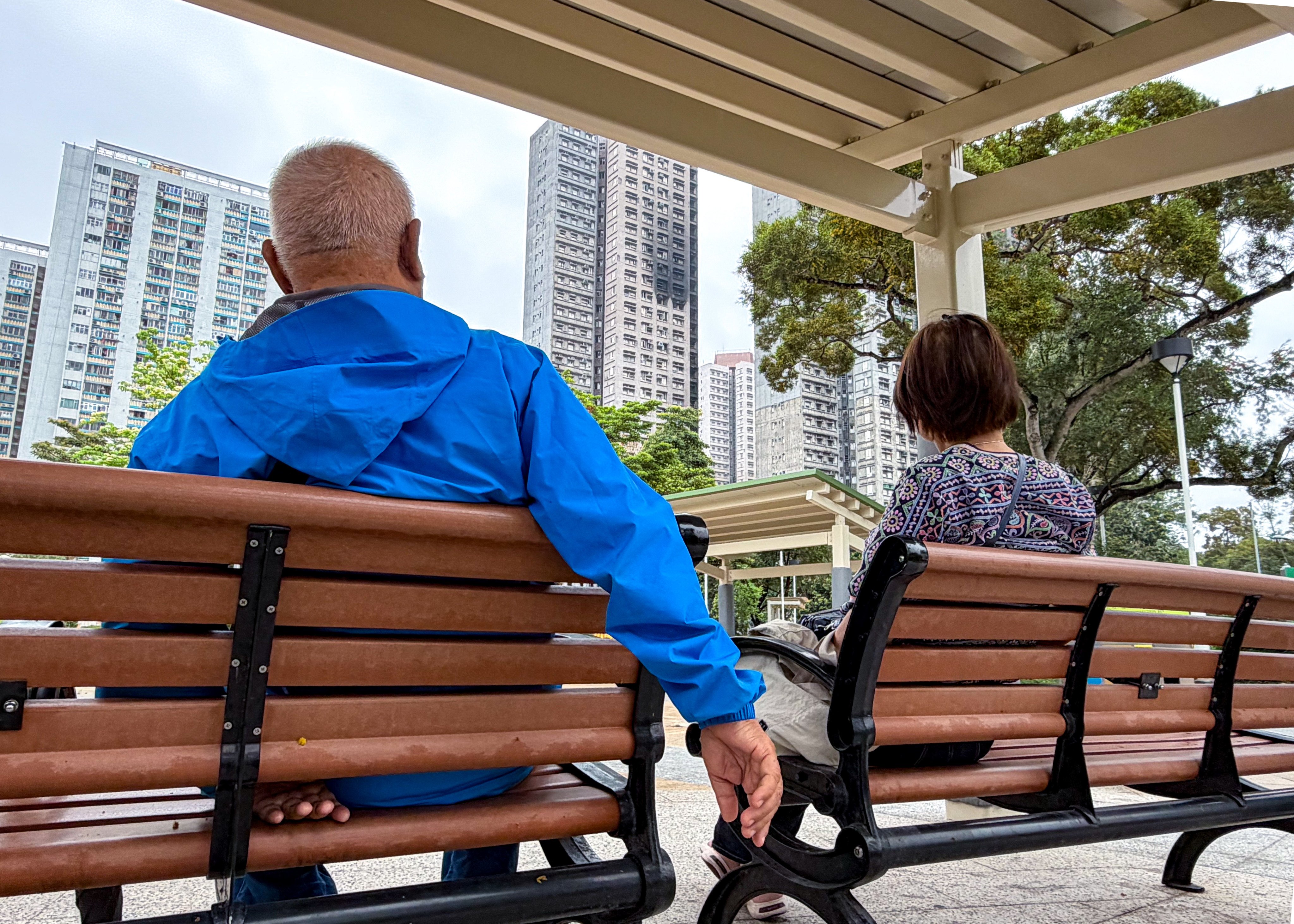 Mr Yau and Mrs Yau, residents of Wang Chi House at Wang Fuk Court in Tai Po, returned to the fire-torn site to mourn their neighbours. Photo: Denise Tsang