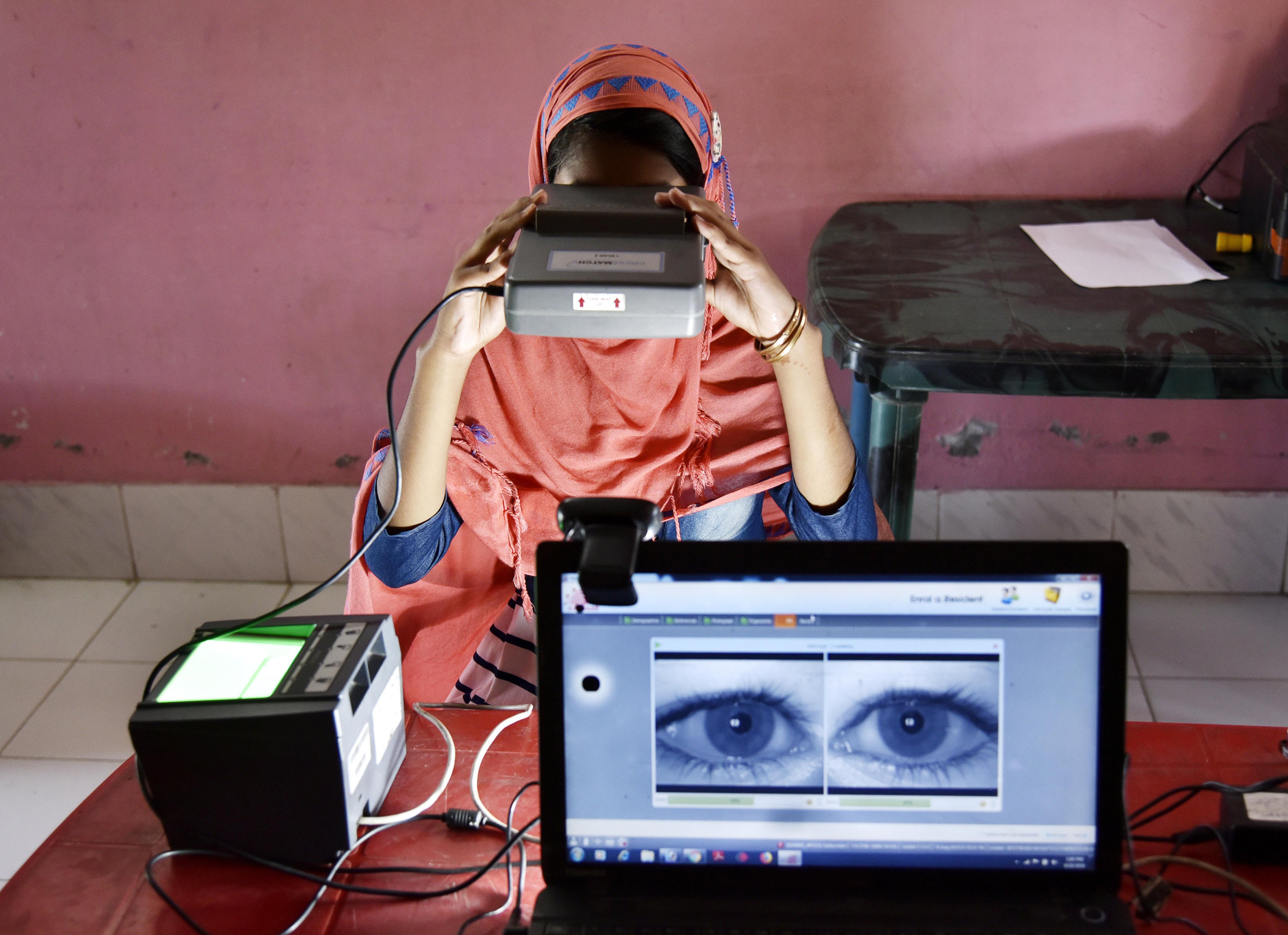 A woman takes an iris scan to link her Aadhar card with the National Register of Citizens at a passport service centre in Barpeta district in India’s north-eastern state of Assam in 2019. Without data governance mechanisms, Global South data could end up being extracted and monetised by foreign platforms for their own gains. Photo: AFP