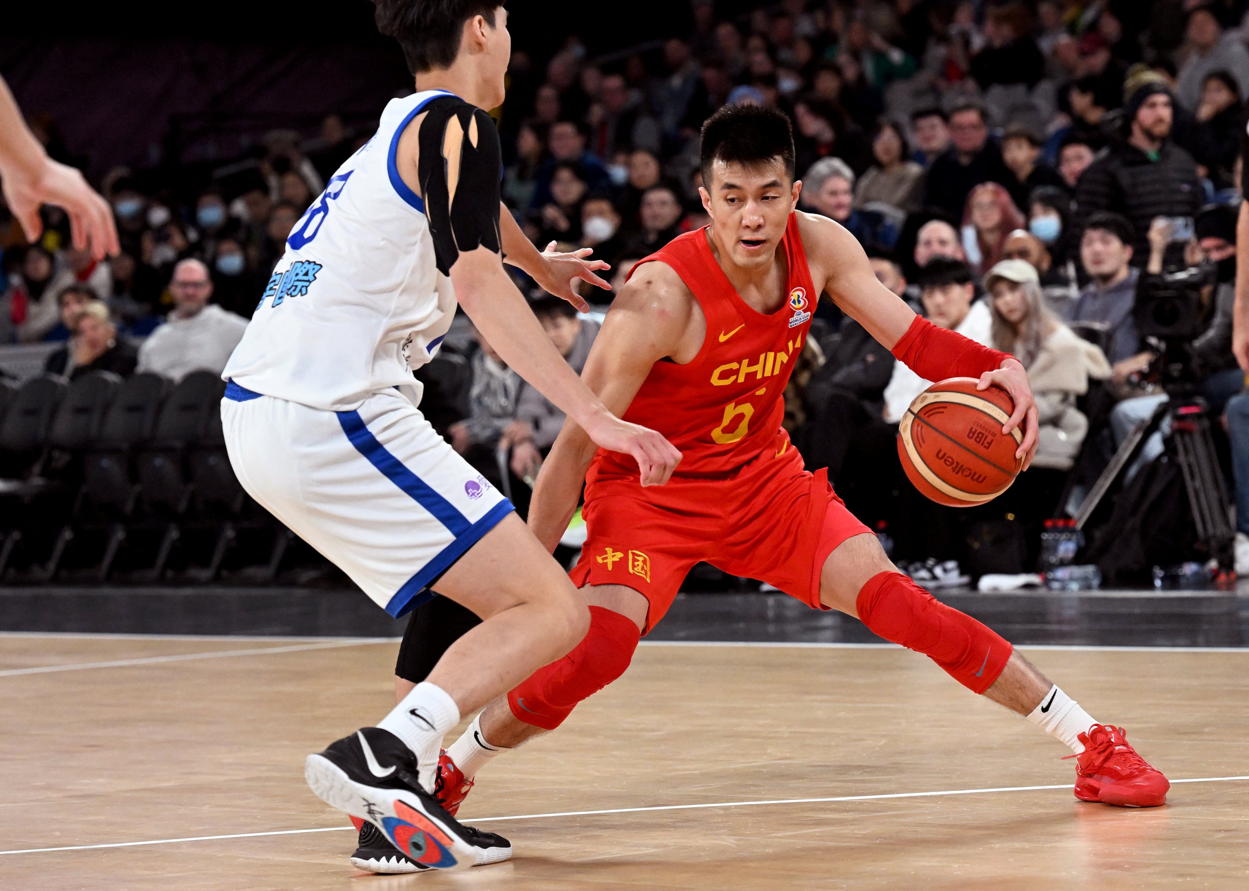 Guo Ailun (right) in action for China in 2022, has filed a report with public security authorities in Shenyang in Liaoning province. Photo: AFP