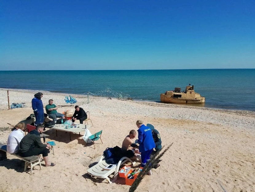 Rescued crew of the  Volgo-Balt on the coast of Russian-controlled Kherson, Ukraine, in a photo released on Sunday. Photo: Vladimir Saldo, leader of the Russian-controlled parts of Kherson region via Telegram / Handout via Reuters