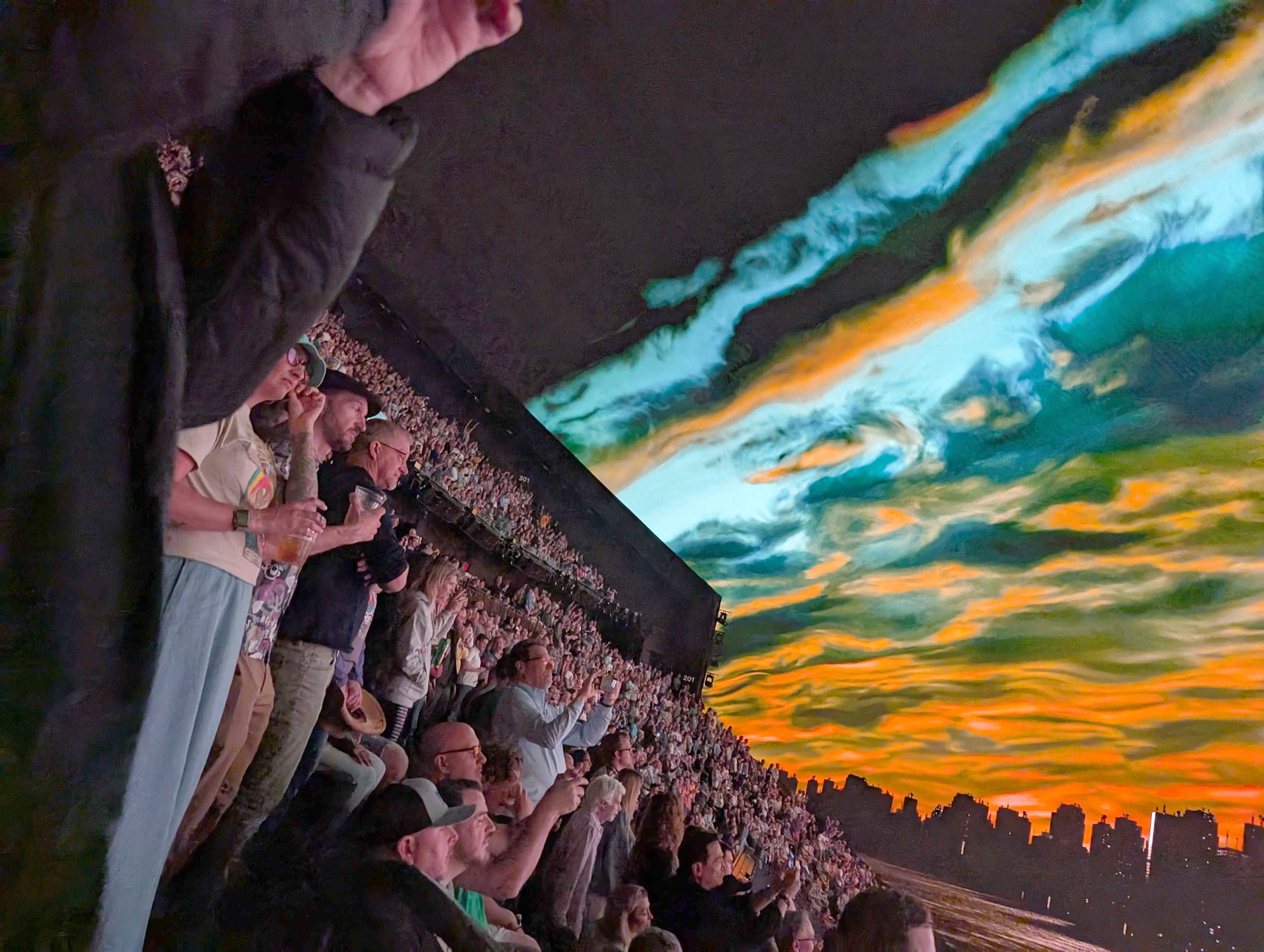People at Las Vegas’ Sphere take in the 360-degree screen as they watch Dead & Company perform on March 22, 2025. Photo: TNS