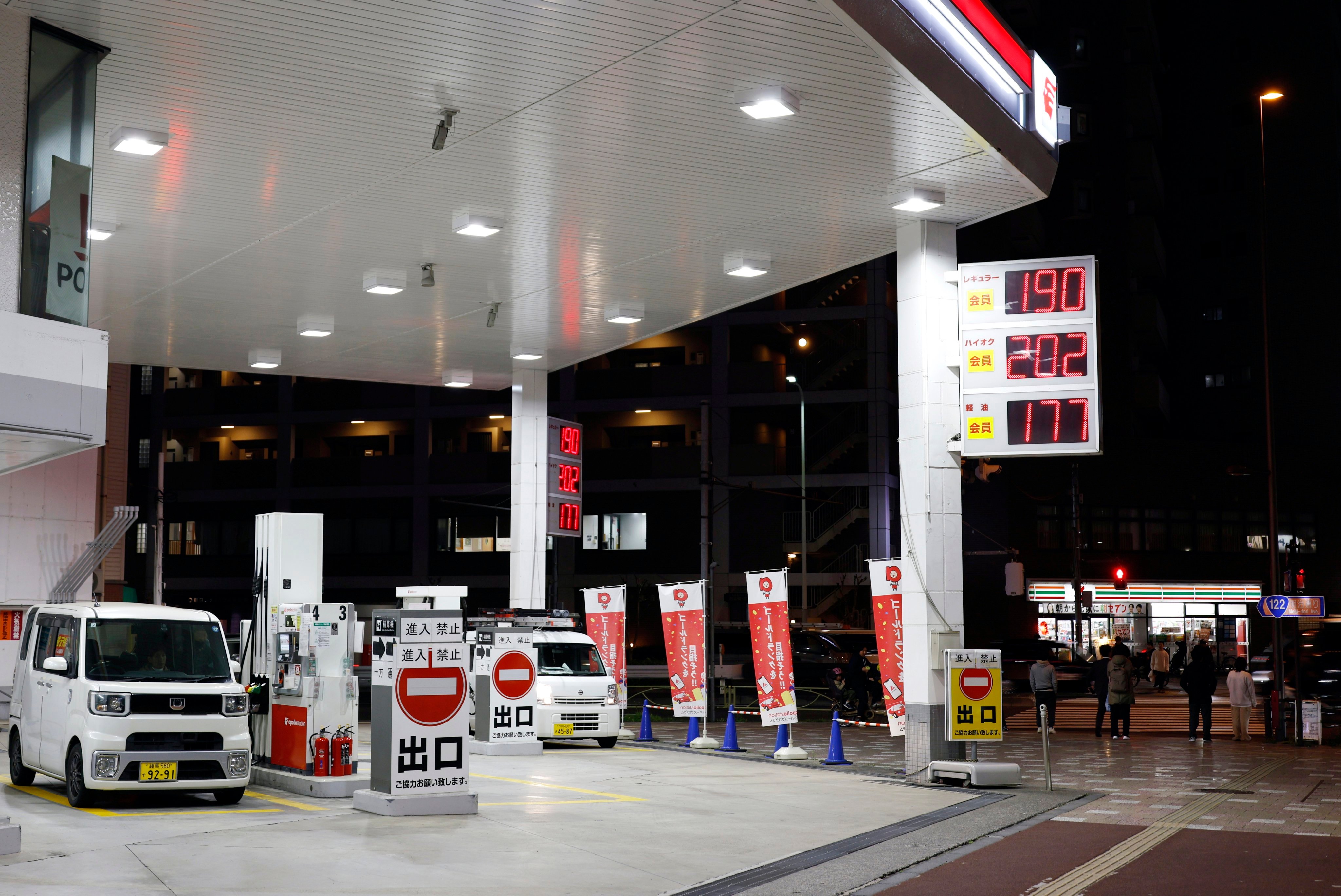Fuel prices are displayed at a petrol station in Tokyo on March 18. Photo: EPA