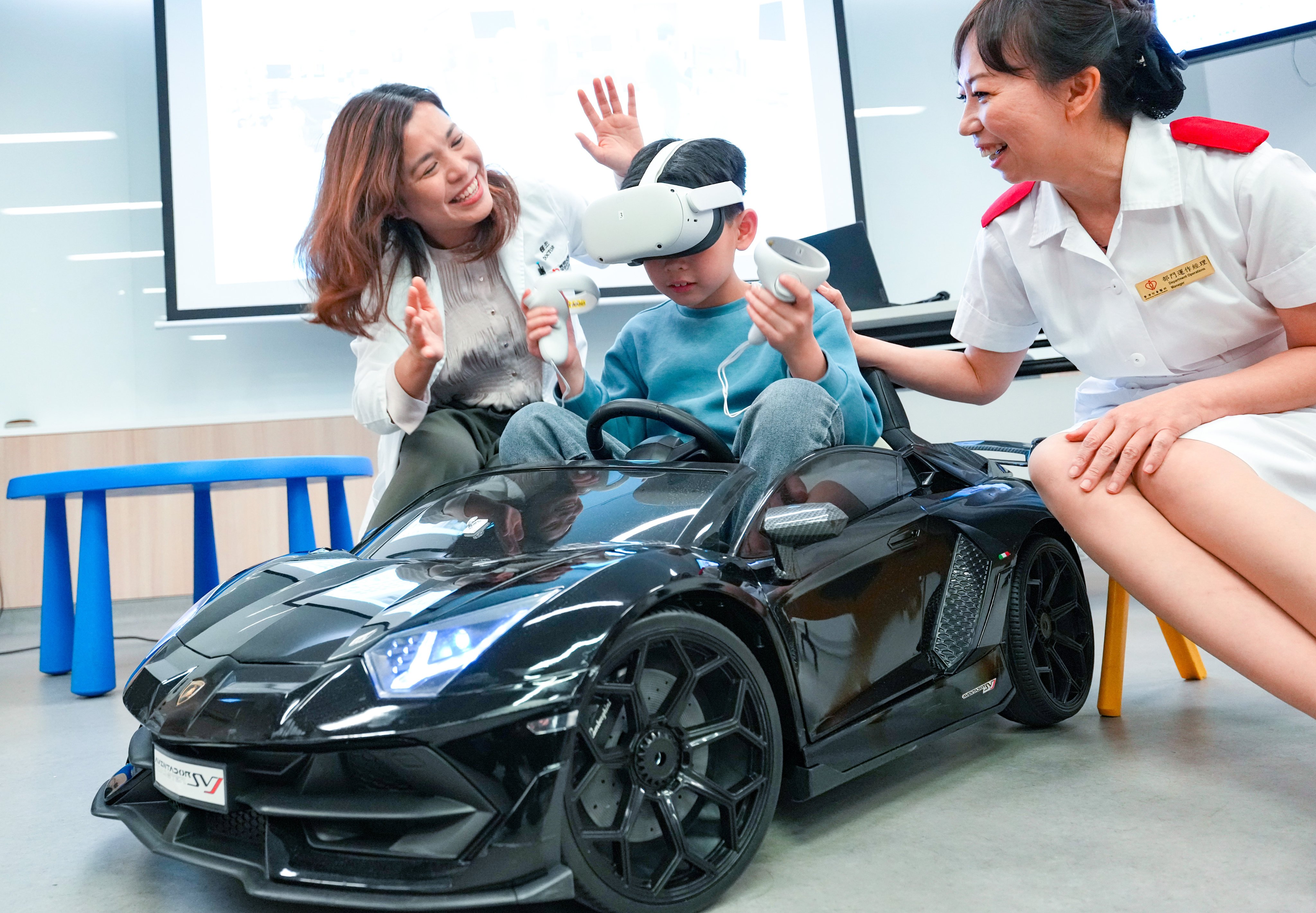 (From left) Anaethesiologist Dr Vansie Kwok, eight-year-old Aidan and operations manager Mok Yi Tan demonstrate the Hong Kong Children’s Hospital’s VR technology, designed to alleviate young patients’ pre-op anxiety. Photo: Jelly Tse