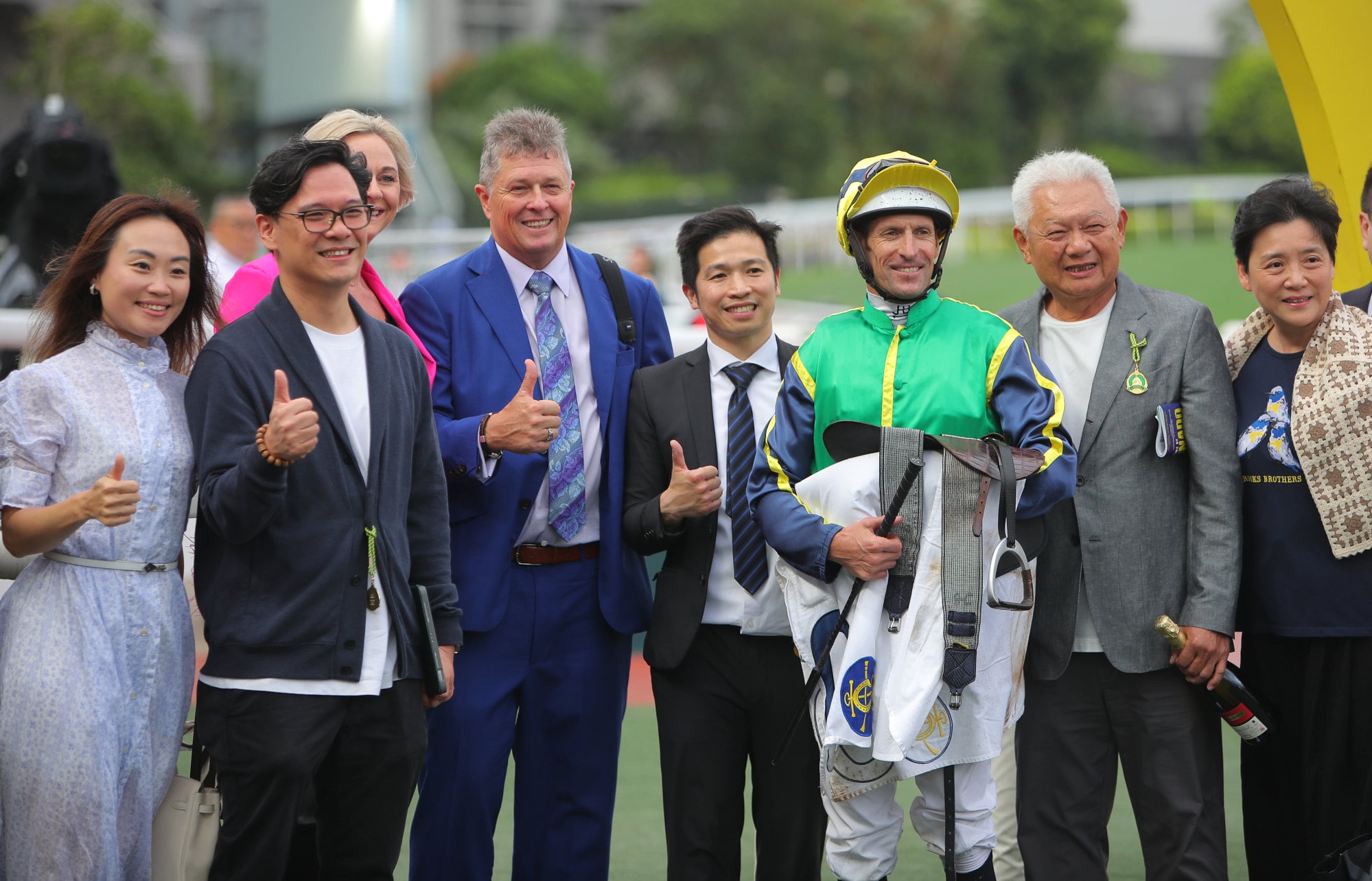 Connections of Mugen celebrate his drought-breaking win.