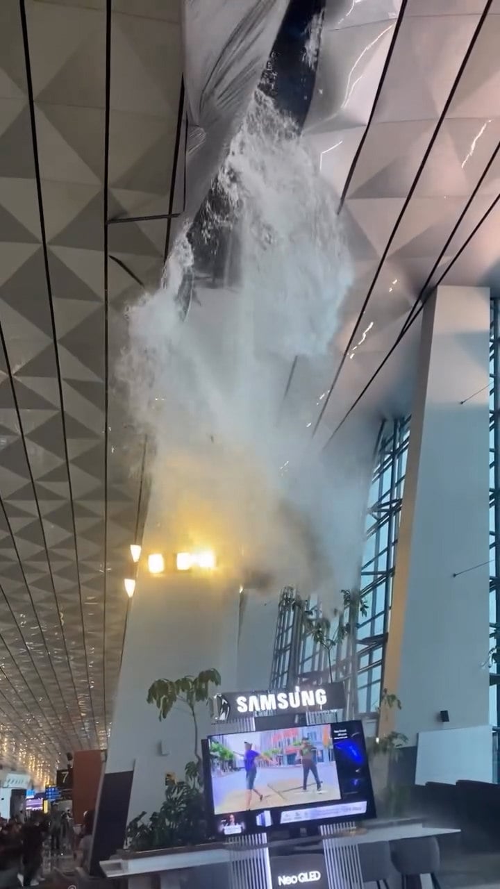 Video circulating on social media shows a moment of panic at Jakarta international airport after a section of the roof collapses