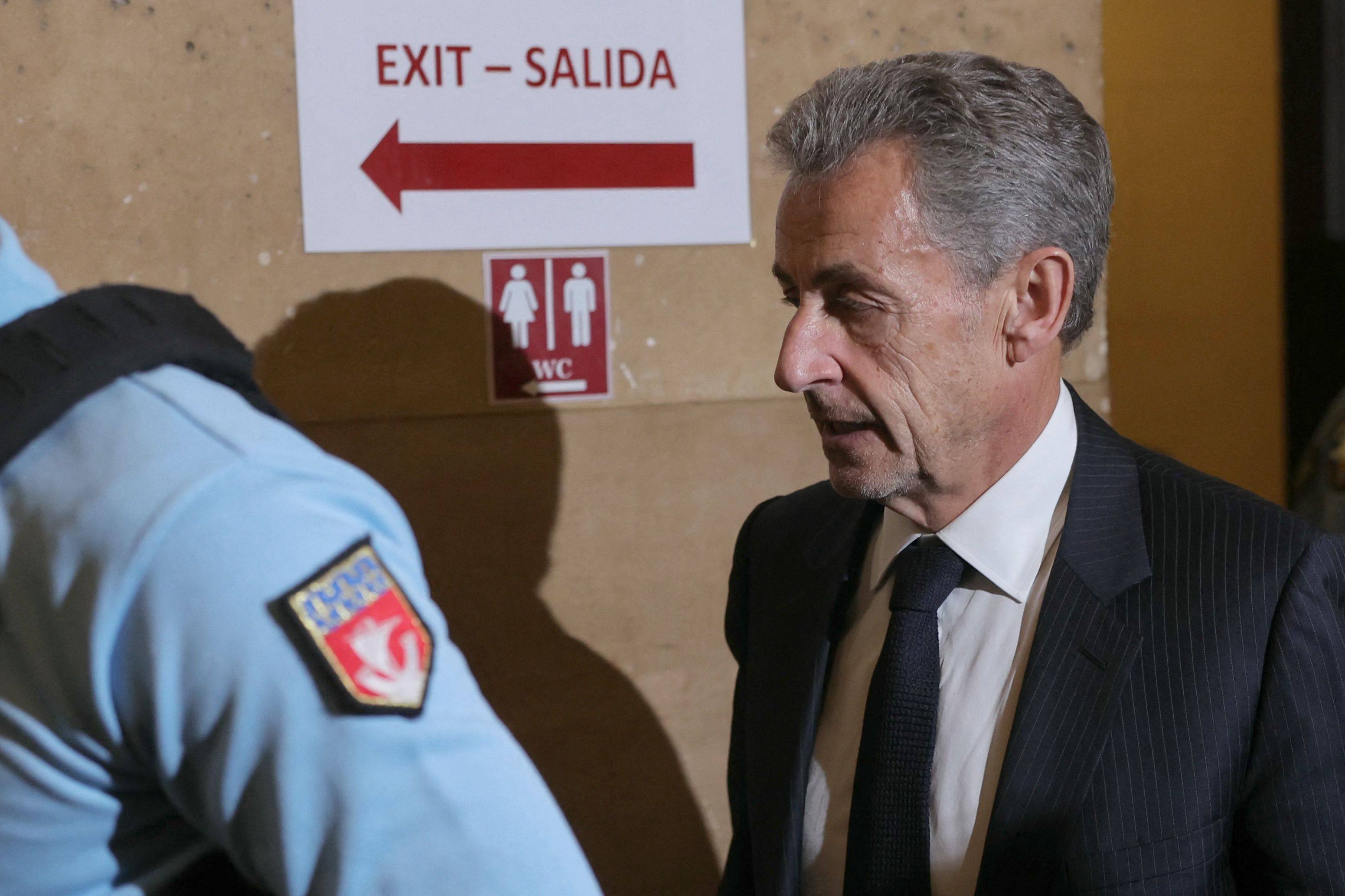 France’s former president Nicolas Sarkozy returns after a break during his appeal trial over charges he sought Libyan financing for his 2007 election, at the Palais de Justice courthouse in Paris on Tuesday. Photo: AFP