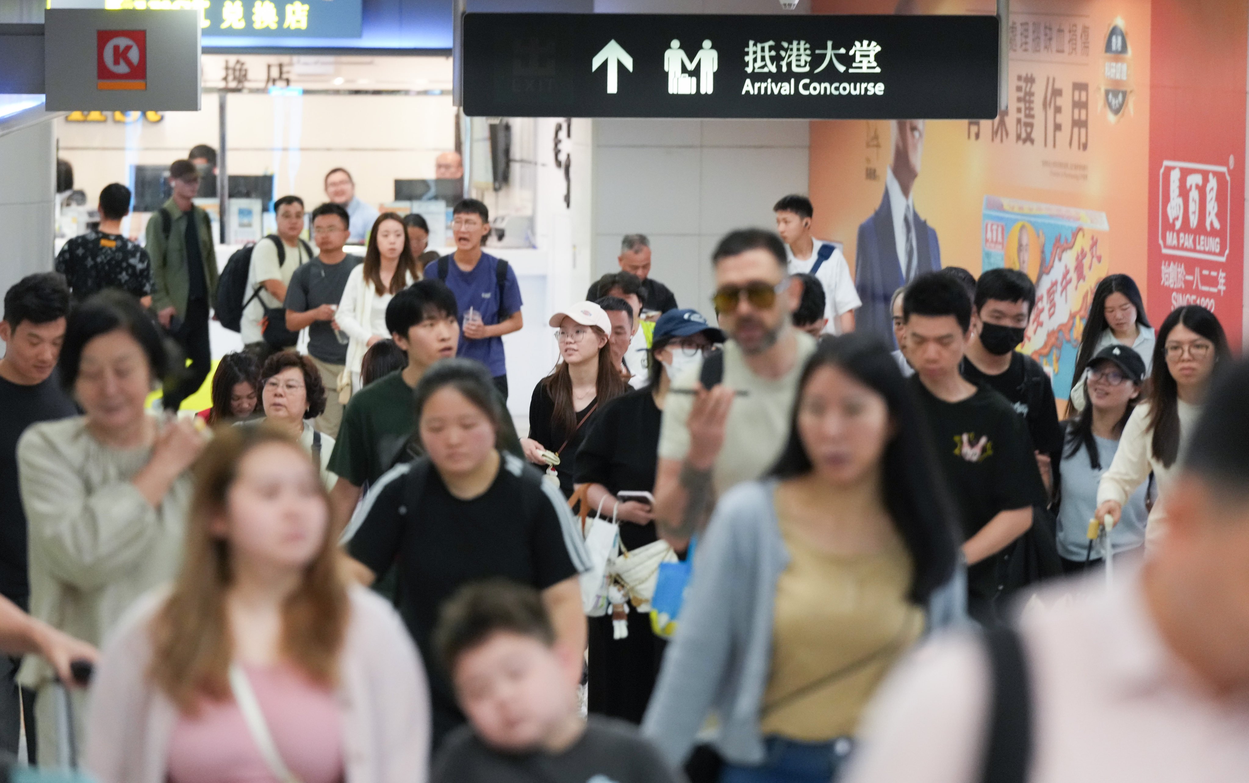 Travellers return to Hong Kong via the West Kowloon high-speed rail terminus on Tuesday. Photo: Jelly Tse