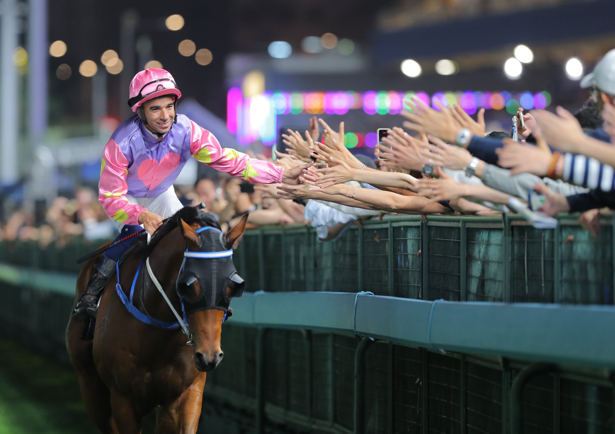 Golden Brilliant and Joao Moreira return after saluting at Happy Valley. Golden Brilliant and Joao Moreira return after saluting at Happy Valley.
