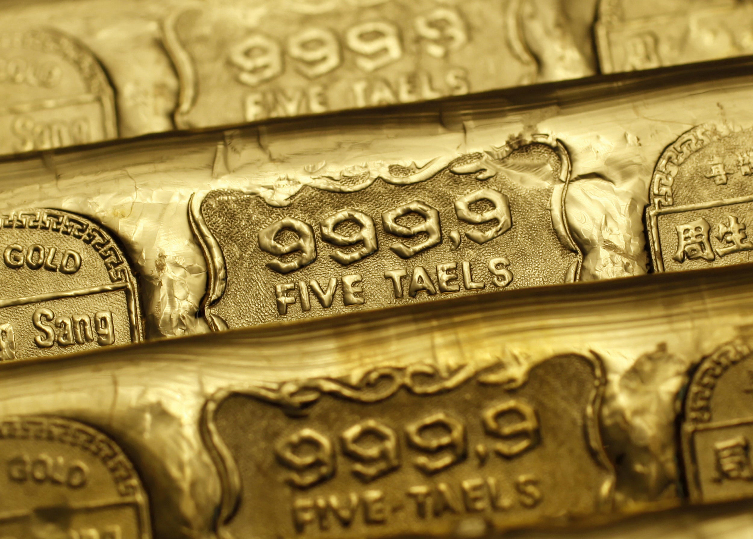 Five-tael (190 grams or 6.65 ounces) gold bars are seen at a jewellery store in Hong Kong as China  is urged to become a global gold hub as Trump’s instability spooks central banks worldwide. Photo: Reuters