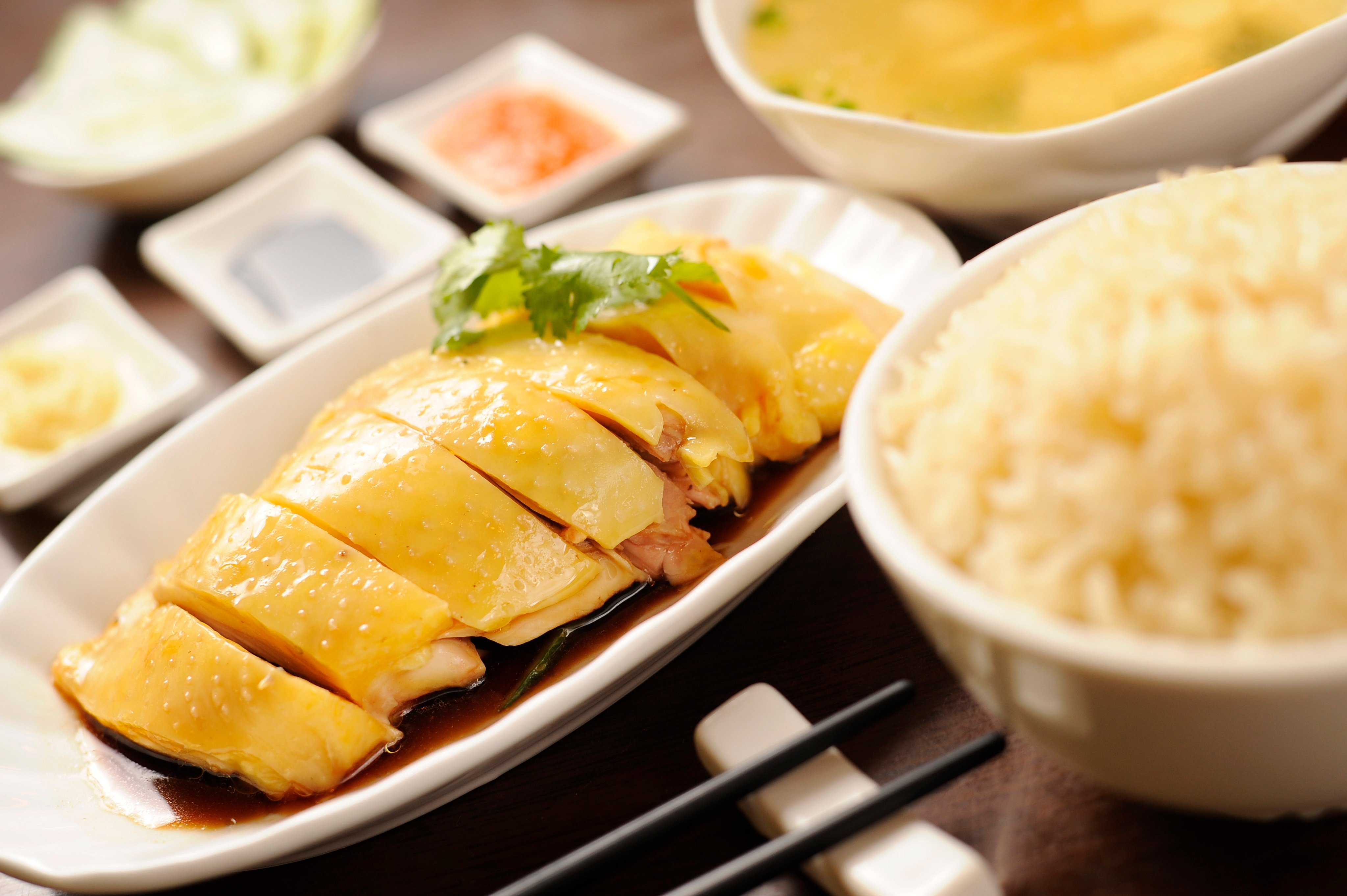 Hainanese chicken rice at a restaurant in Hong Kong. From humble origins on the Chinese island of Hainan, the dish spread across Asia, evolving into much-loved local variations from Singapore to Vietnam. Photo: Warton Li