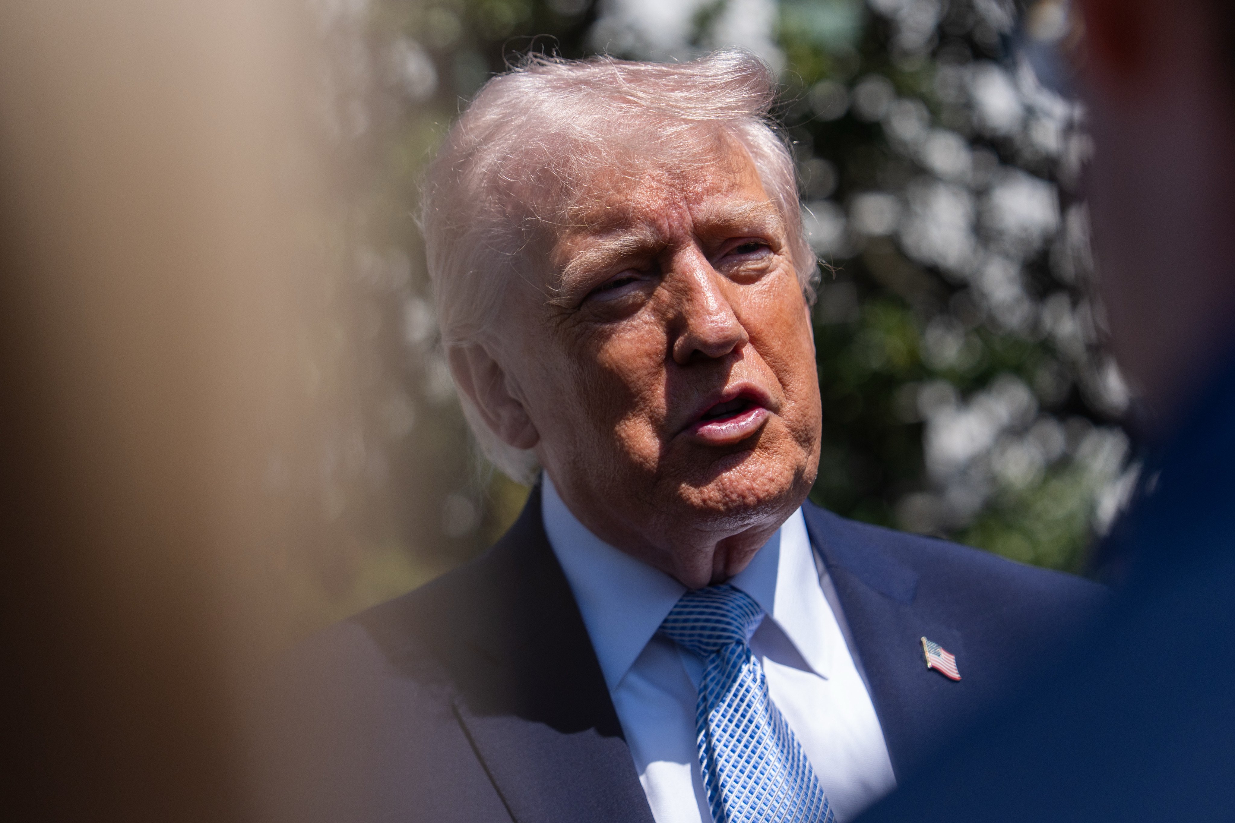 US President Donald Trump speaks to reporters as he warns of potential escalation ahead of a deadline for Iran to accept a peace deal. Photo: AP