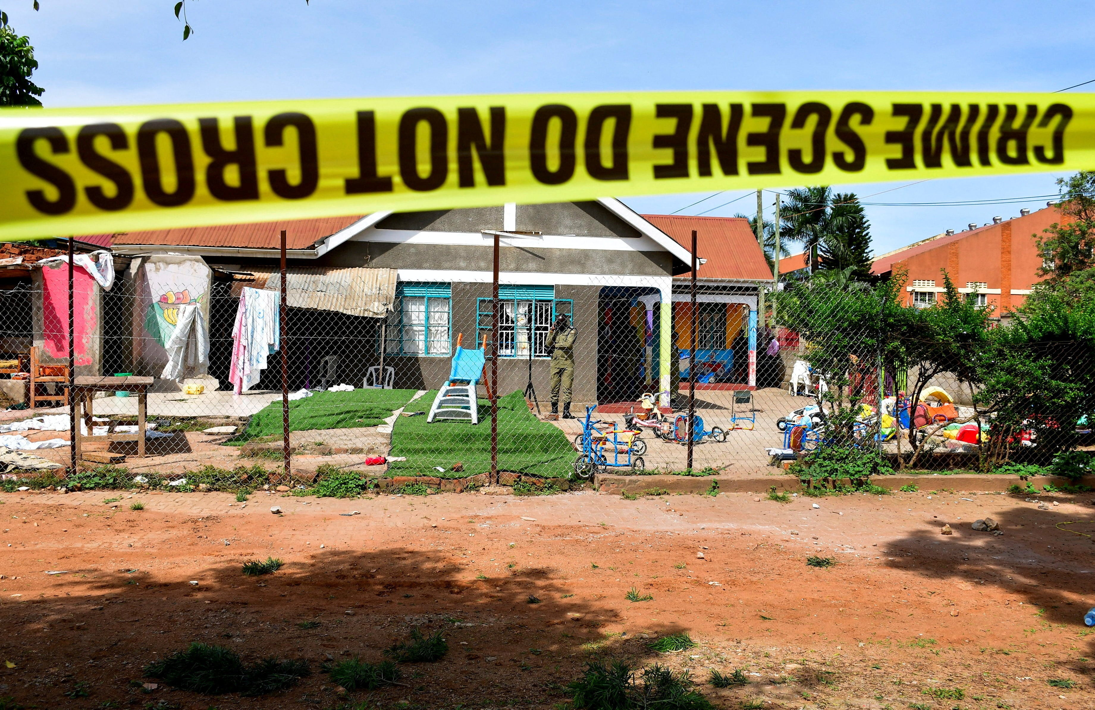 Police tape is seen at the scene of a stabbing attack at a kindergarten in Kampala, Uganda, on April 2. Photo: Reuters