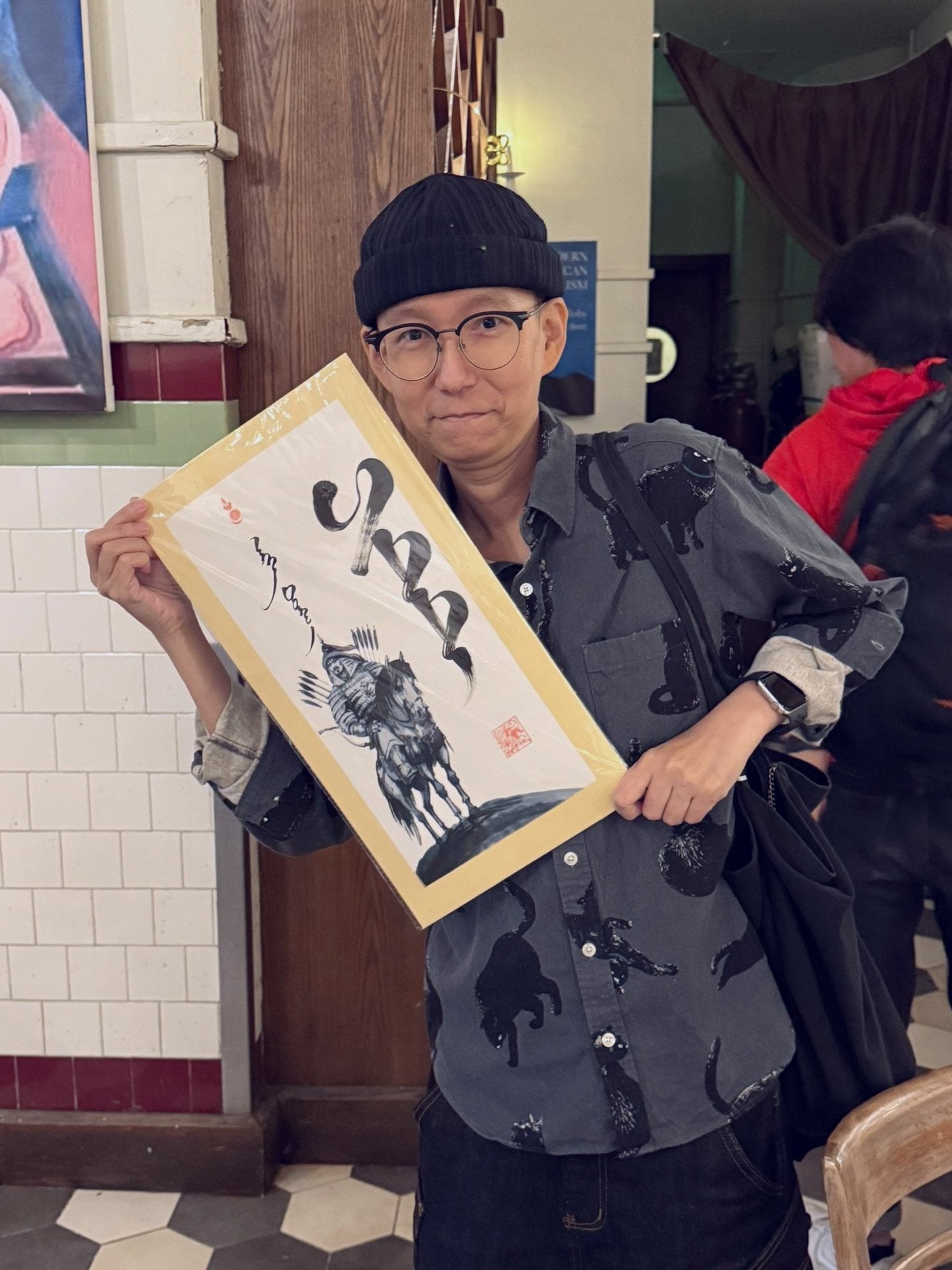 An August 2025 post on nasopharyngeal cancer patient Pitt Cheung’s Instagram account shows him holding a placard bearing a blessing written in Mongolian. Photo: Instagram/pittcheung