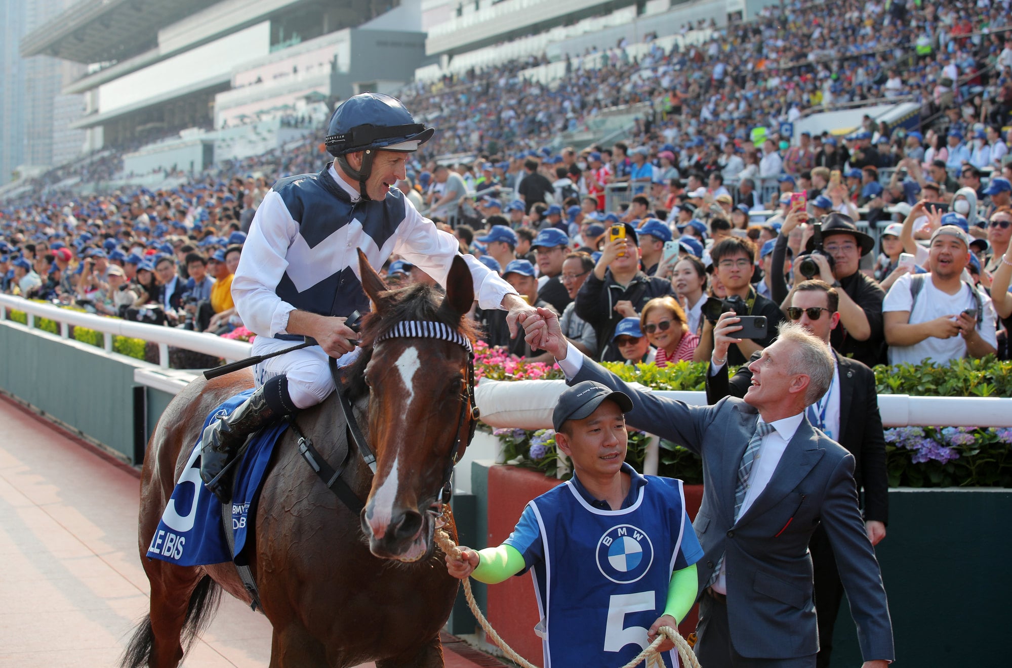 Jockey Hugh Bowman and trainer Mark Newnham celebrate Invincible Ibis’ Derby success.
