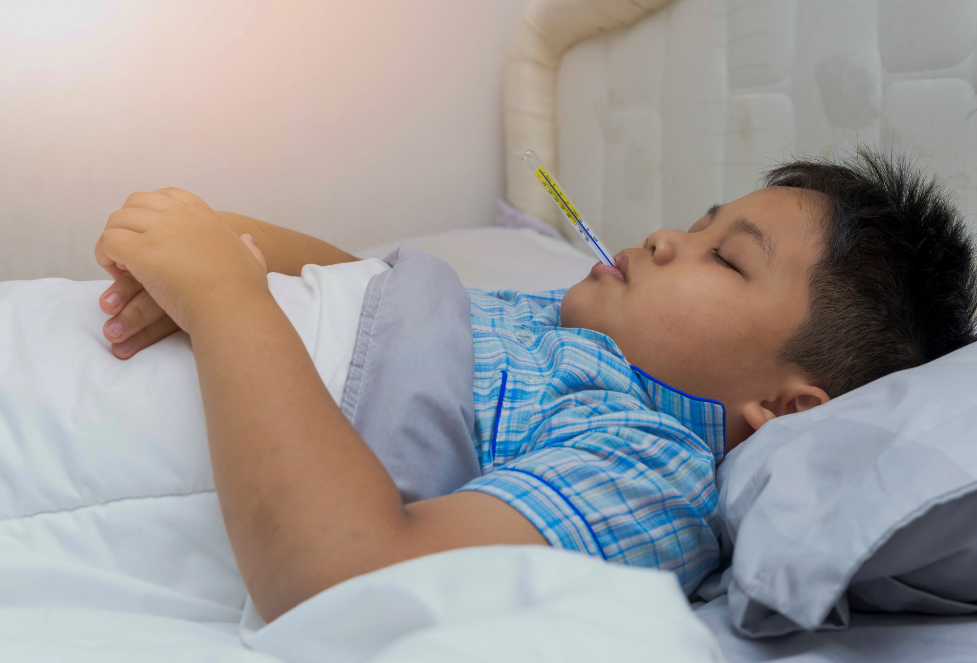 A sick boy has his temperature taken. Wang swallowed the device when he was 12 years old. Photo: Shutterstock