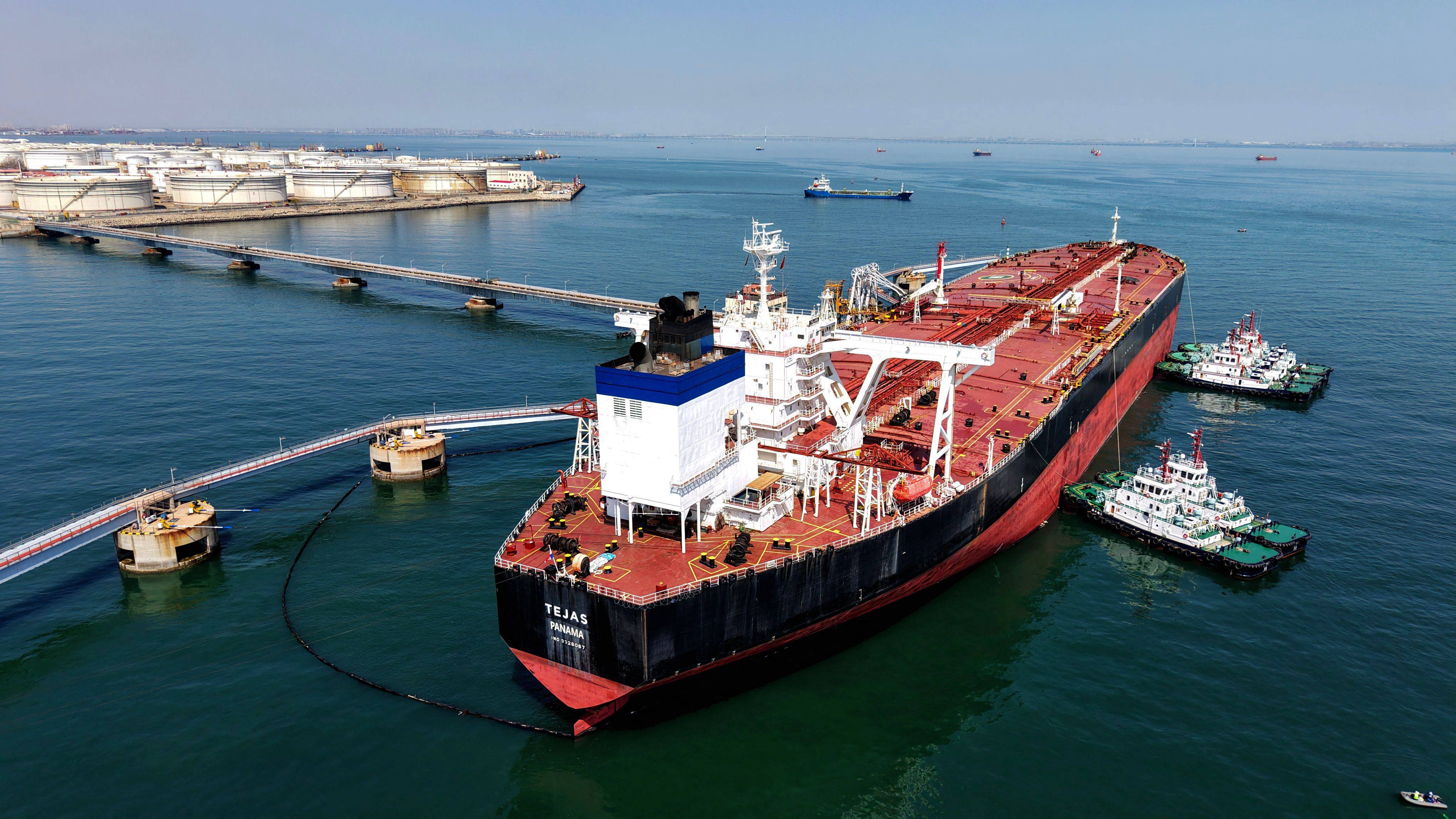 An oil tanker unloads crude oil at the port in Qingdao, in eastern Shandong province, on April 7. Photo: AFP