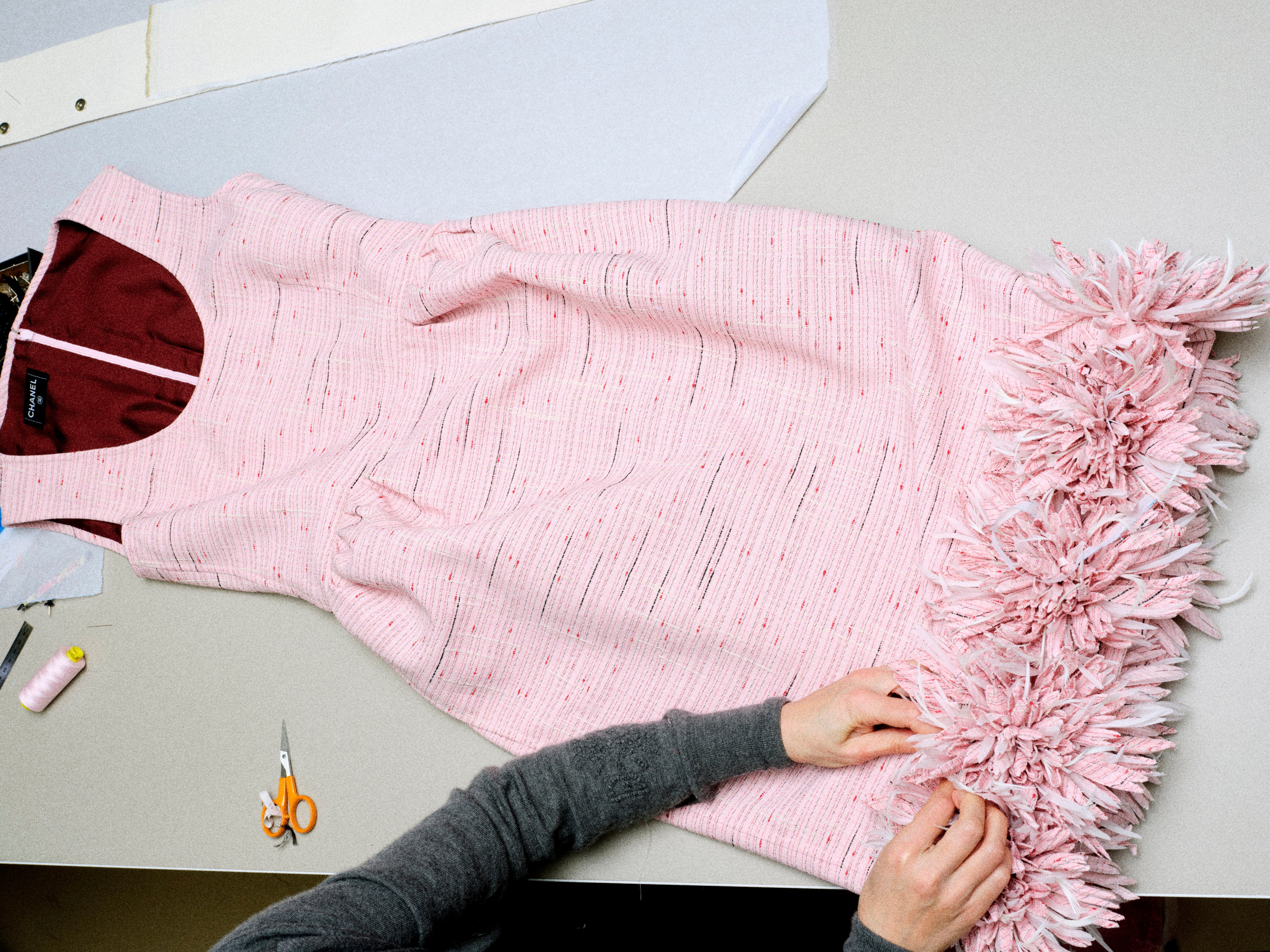 Le19M, Chanel’s new, purpose-built site dedicated to the métiers d’art, houses hundreds of artisans, including flower-making specialists Lemarié – shown here preparing a garment during the making of Chanel’s Métiers d’Art 2026 collection. Photo: Handout