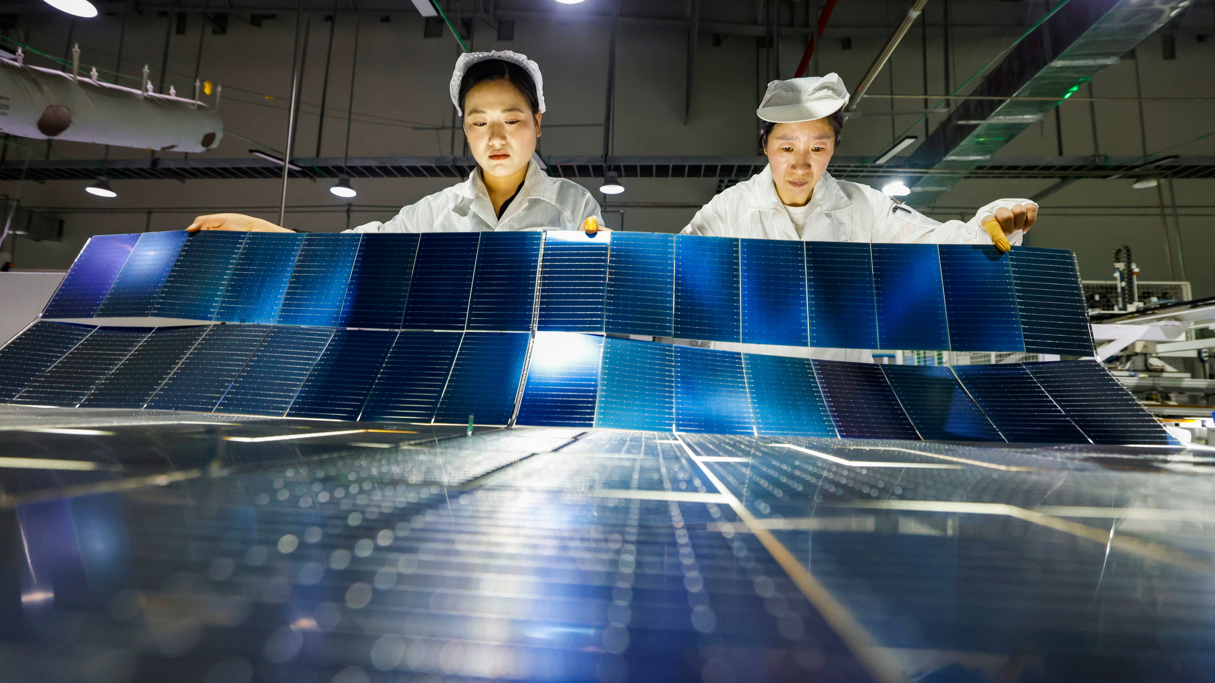 Employees work on the production line of solar panels at a workshop of Jiangsu DMEGC New Energy on February 25, 2026, in Sihong county, Suqian city, in China’s Jiangsu province. Photo: VCG via Getty Images