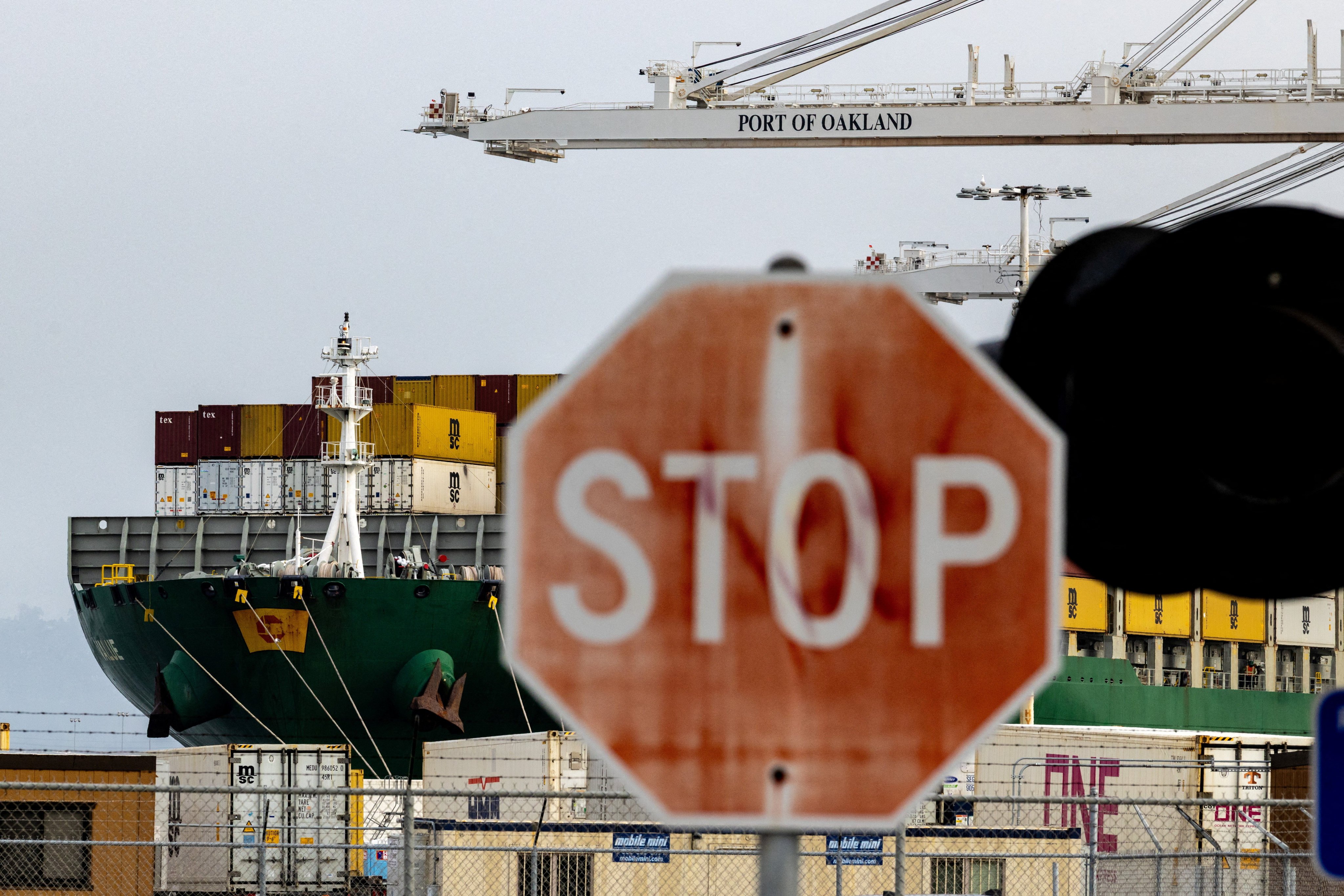 A cargo ship loaded with shipping containers is seen at the Port of Oakland in California, in February. Photo: Reuters