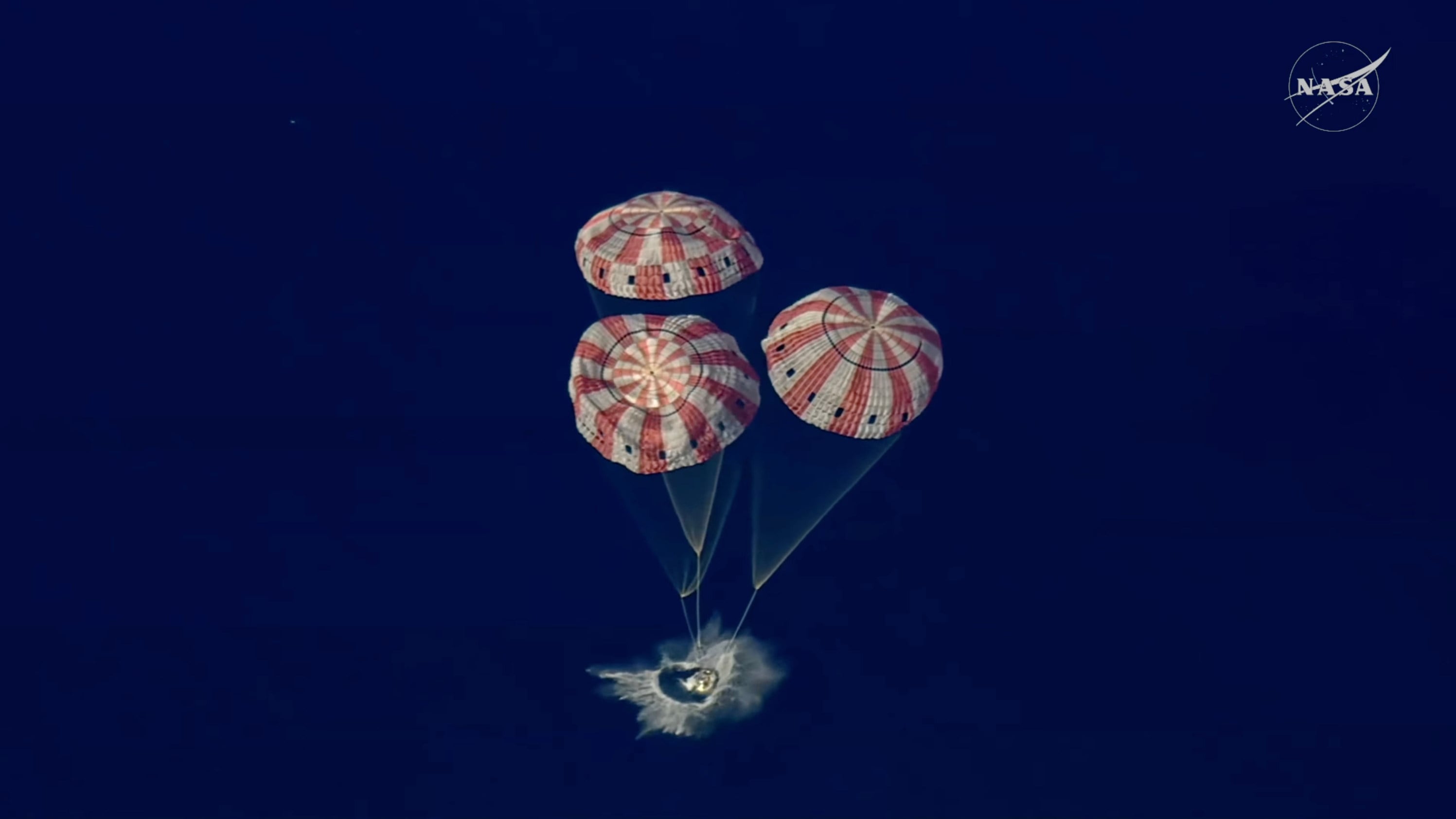 In this image from video provided by Nasa, the Artemis II Orion capsule splashes down in the Pacific Ocean on Friday. Photo: Nasa/AP