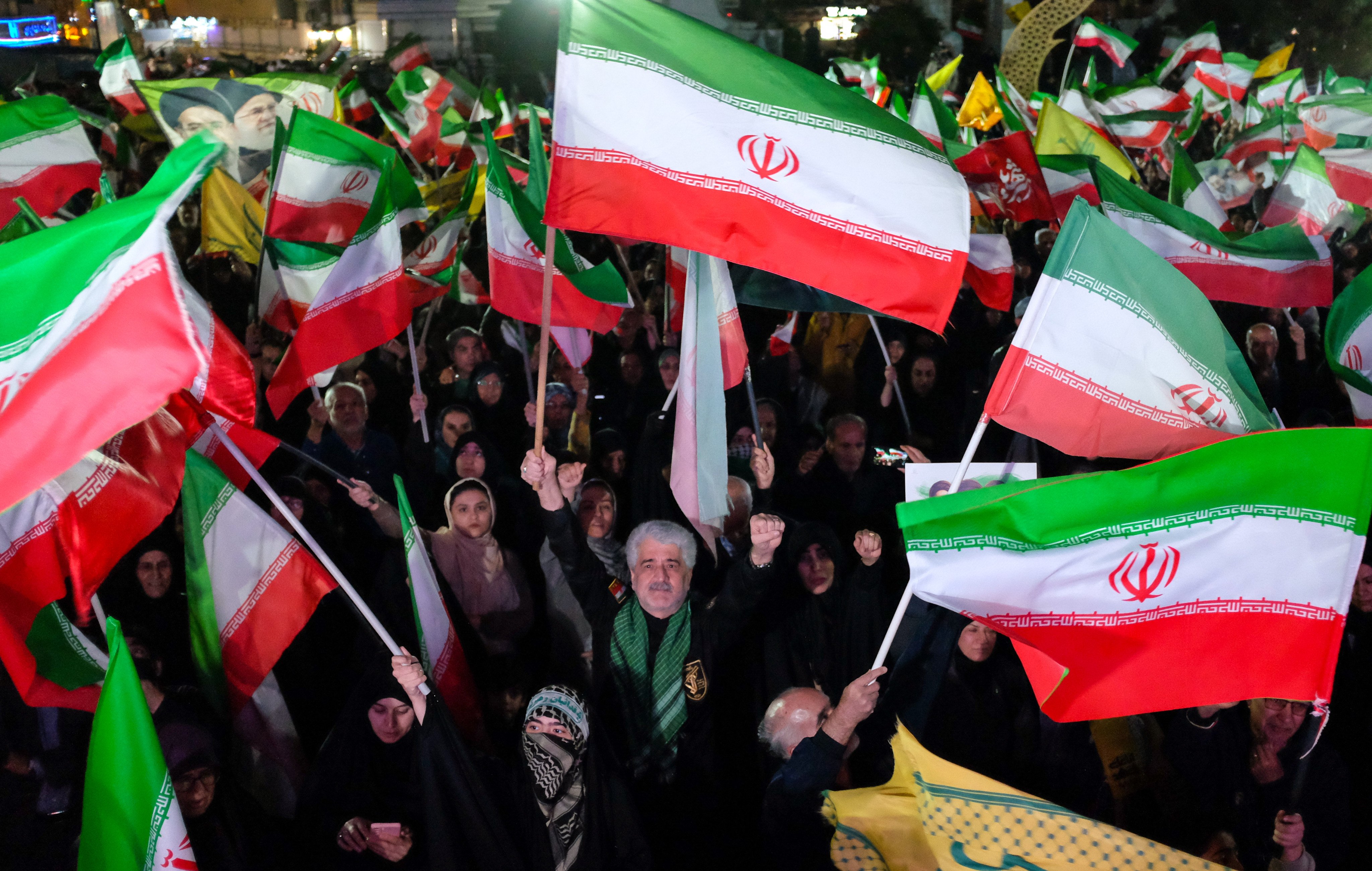 Pro-government demonstrators take to the streets of Tehran on Saturday. Photo: AP