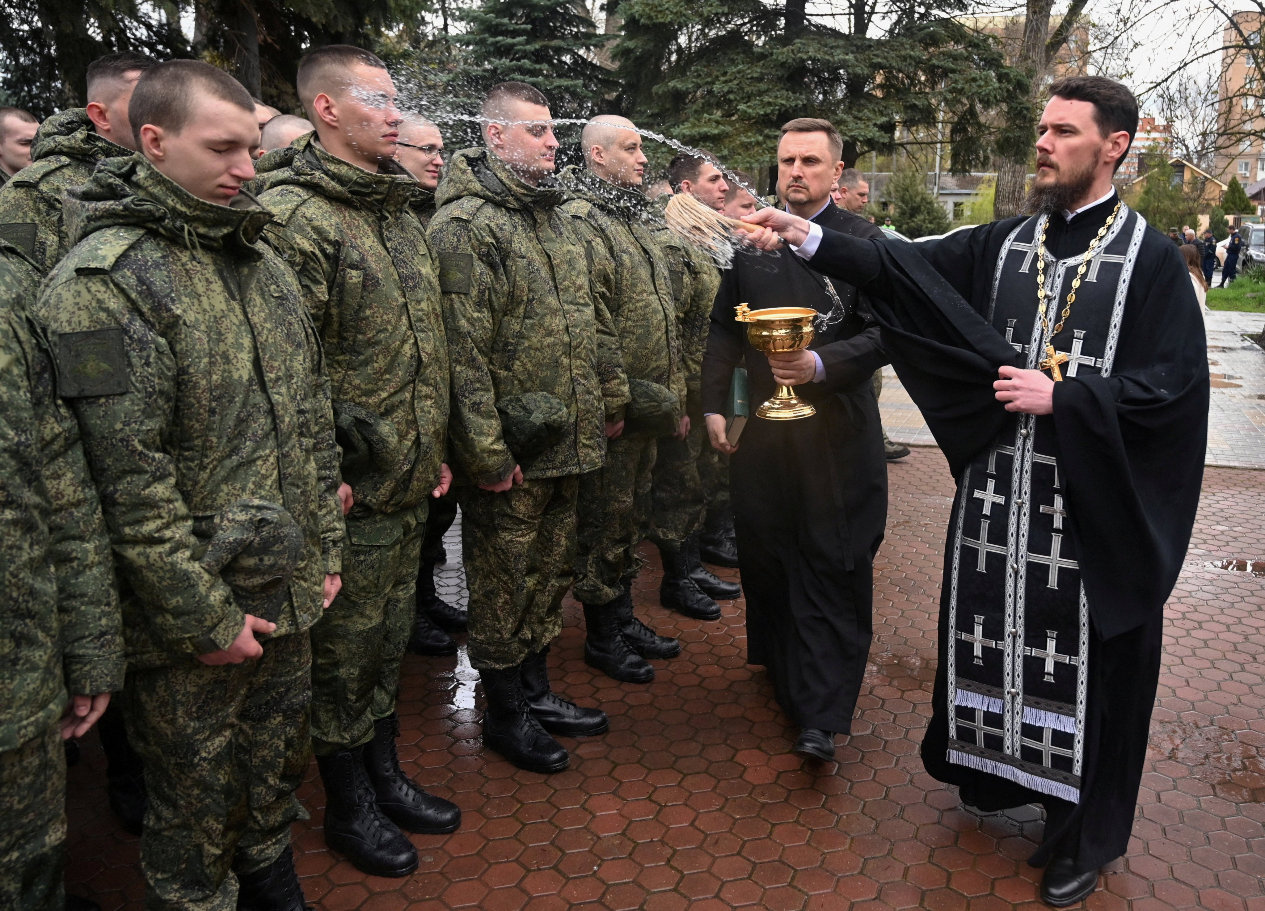 An Orthodox priest blesses Russian conscripts during a ceremony in Bataysk, in the Rostov region of Russia on Friday. Photo: Reuters