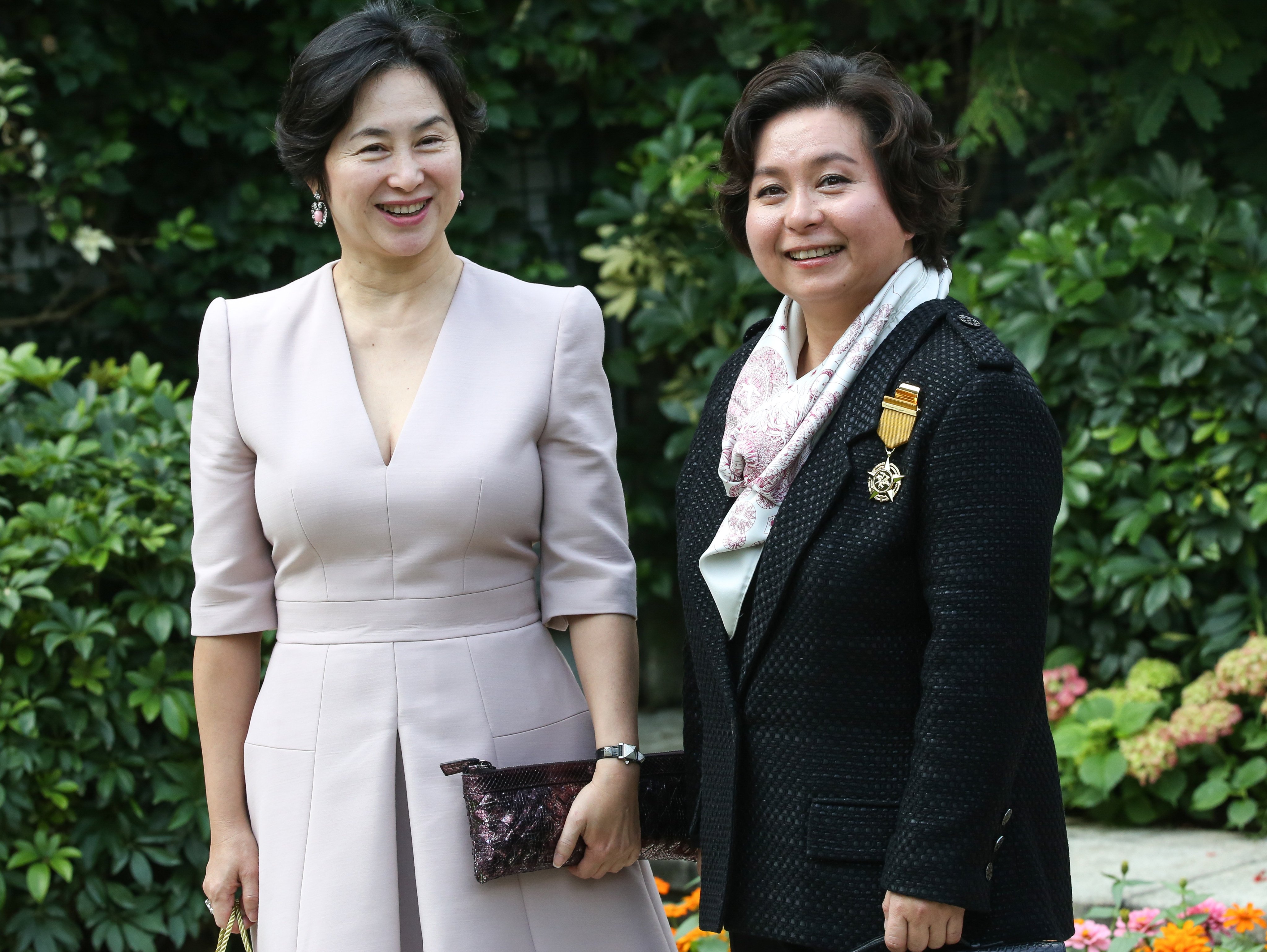 Maisy Ho (right) and her sister, Pansy Ho, attend a ceremony at Government House in 2016, where Maisy received the Bronze Bauhinia Star. Photo: Edward Wong