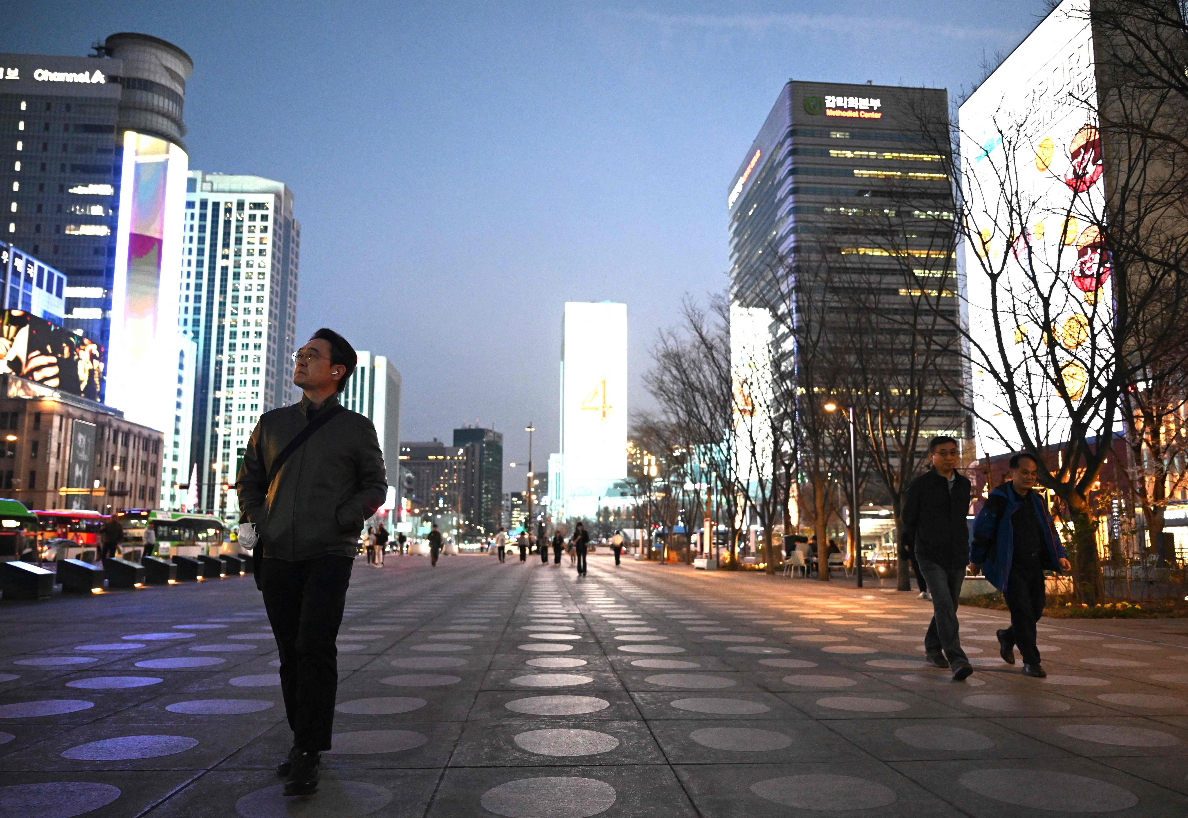 People walk through Gwanghwamun Square in Seoul, South Korea, earlier this month. Photo: AFP