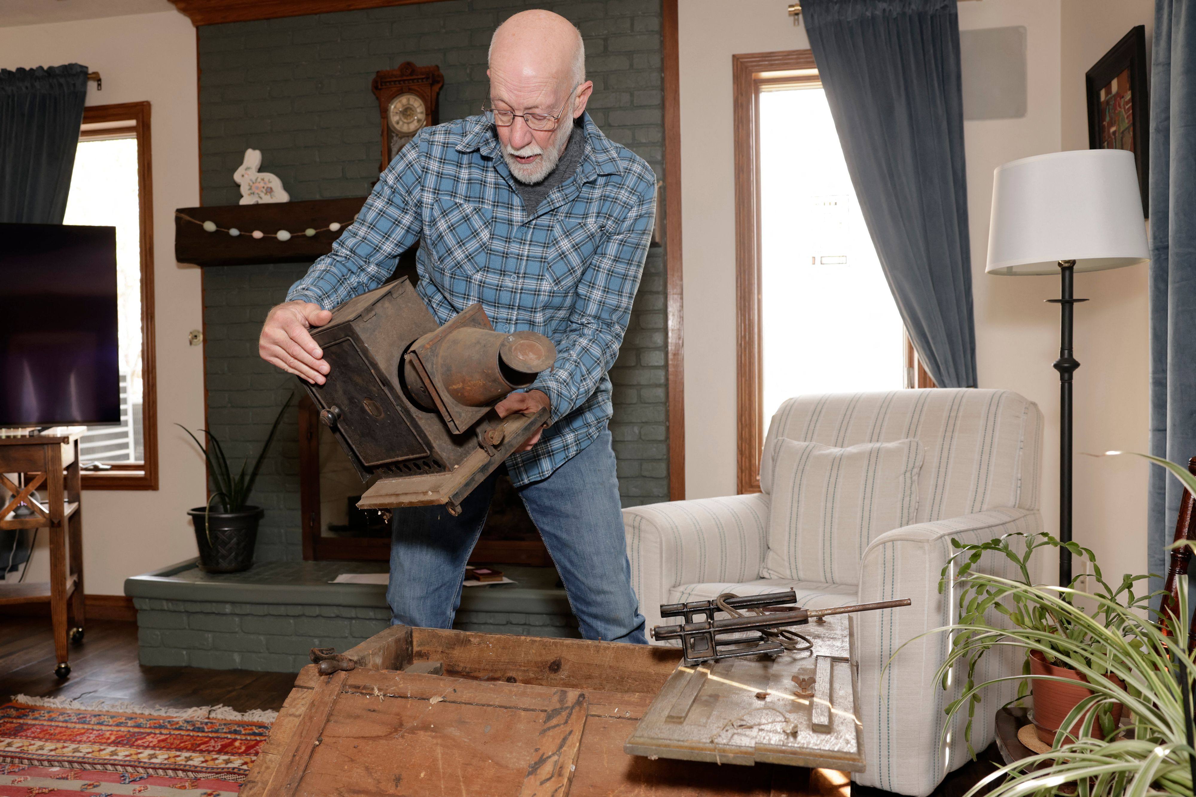 Bill McFarland holds his great-grandfather William DeLyle Frisbee’s magic lantern slide projector at his home in Jenison, in the US state of Michigan, in March 2026. Photo: AFP