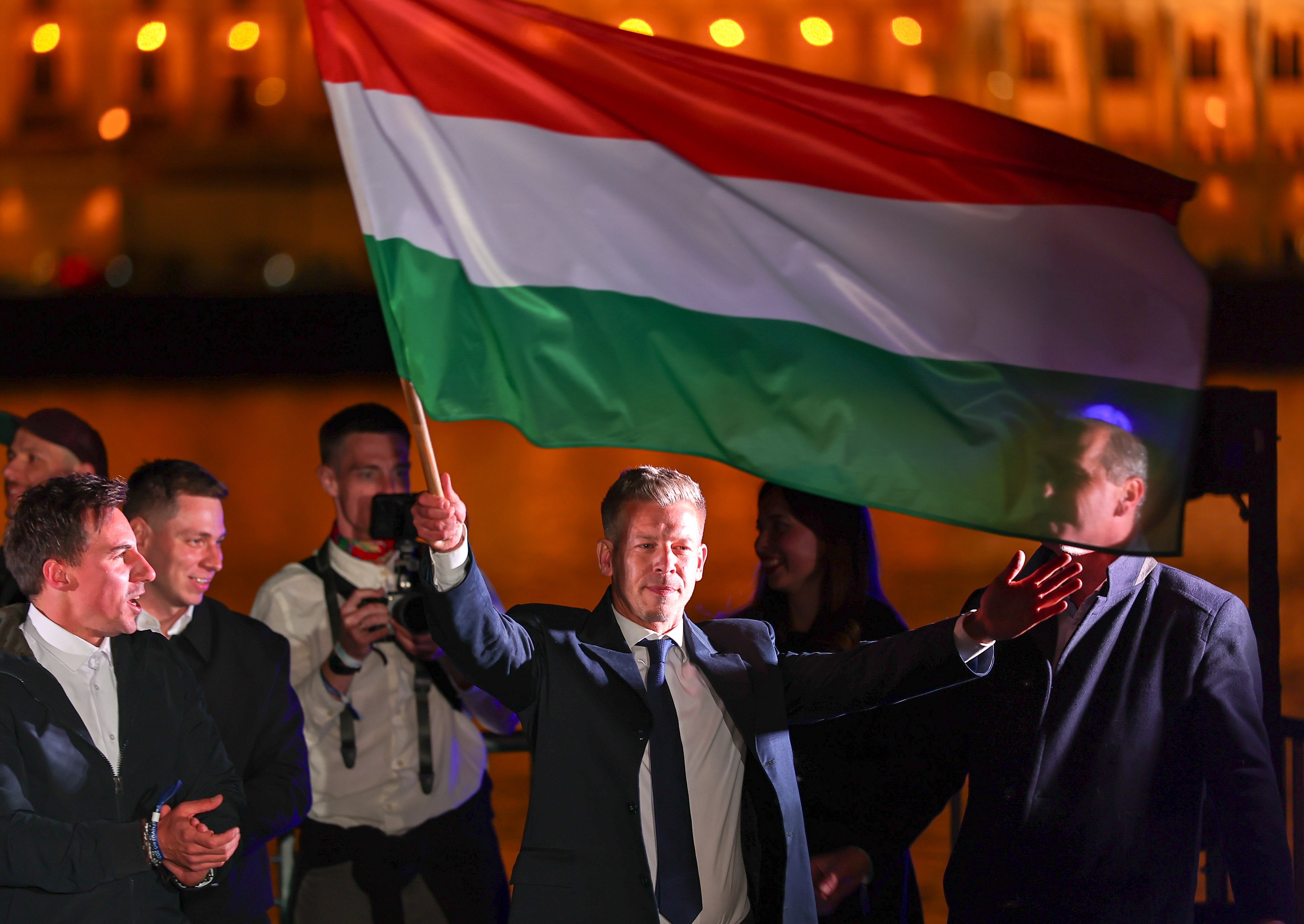 Peter Magyar, leader of Hungary’s Tisza Party, waves the national flag at a victory rally in Budapest on Sunday. Photo: Xinhua