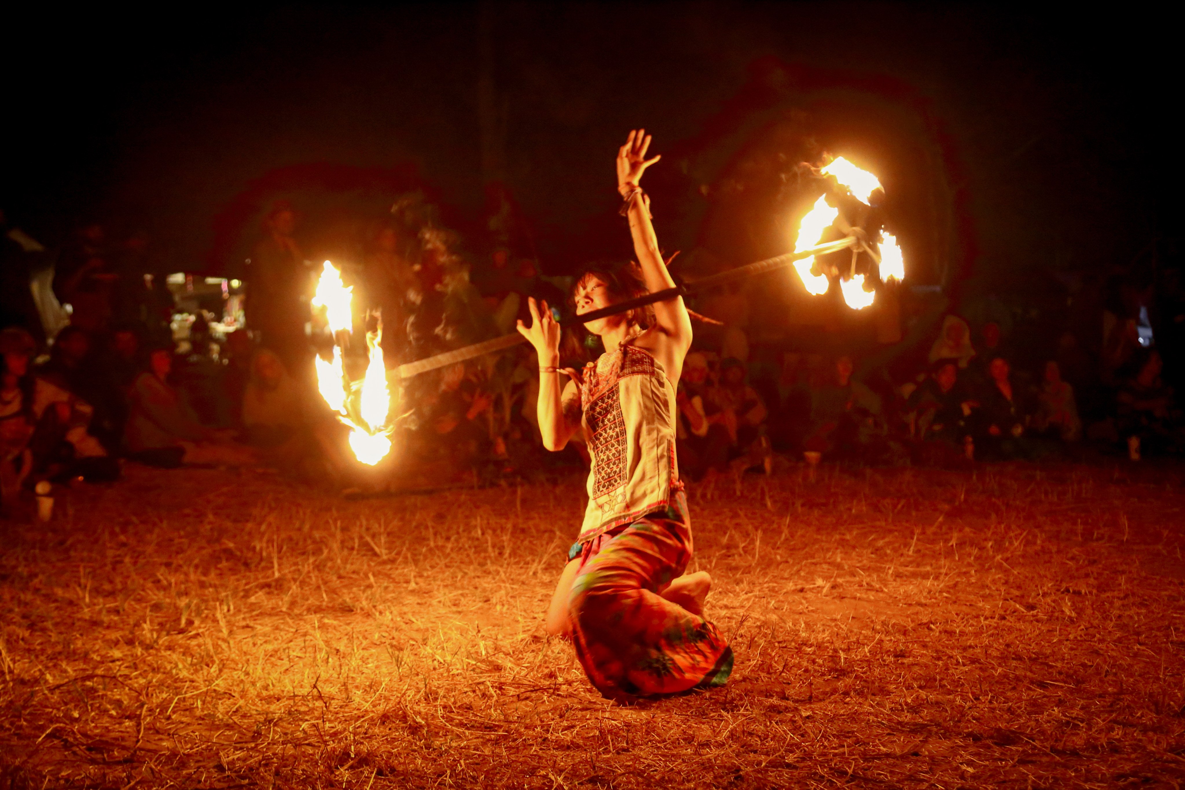 Zizi, a Chinese participant performing fire spinning at “Shambhala in Your Heart” festival. Photo: David Frazier