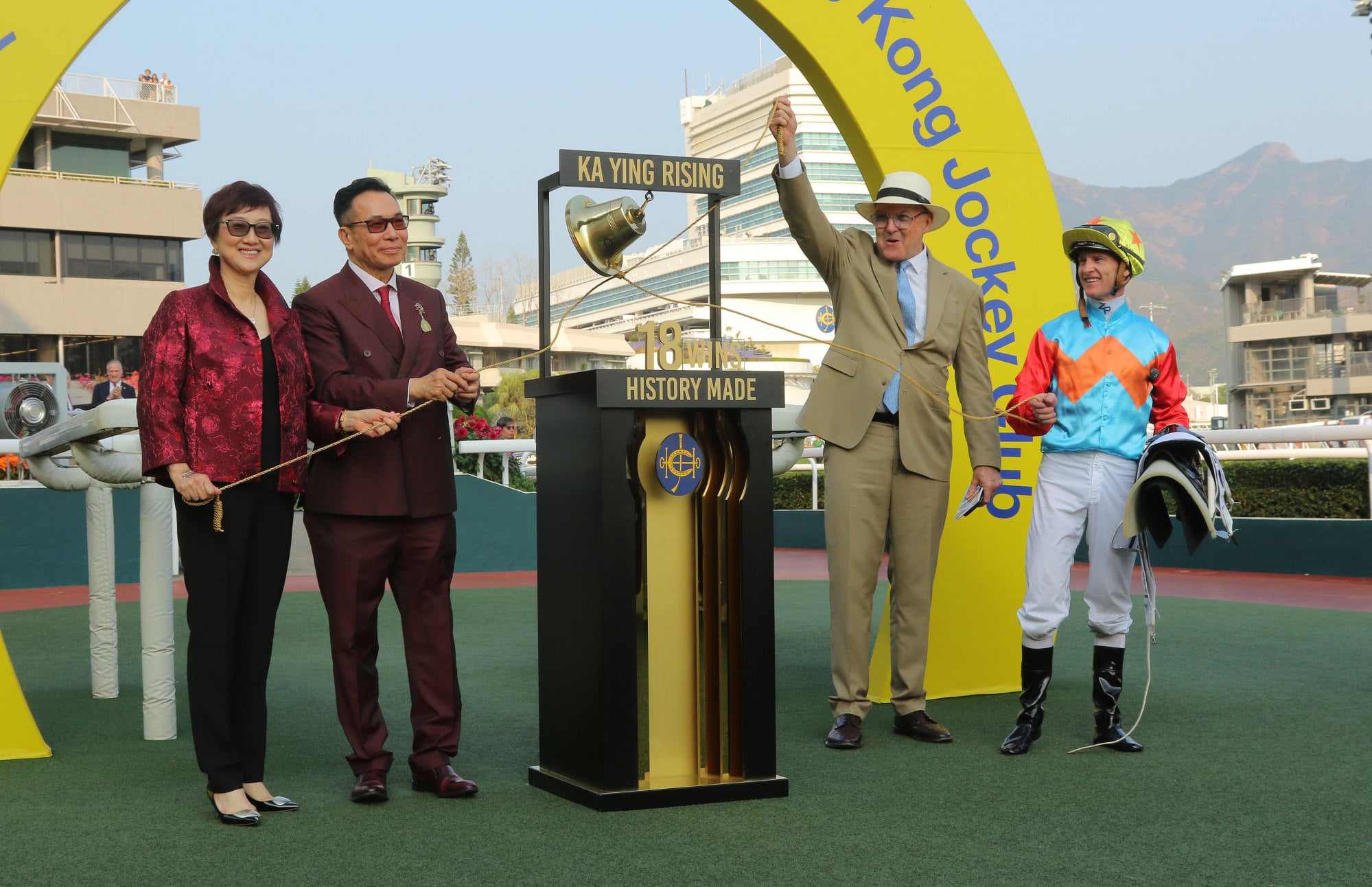 Owner Leung Shek-kong (second from left), trainer David Hayes (second from right) and jockey Zac Purton celebrate Ka Ying Rising’s historic victory in February.
