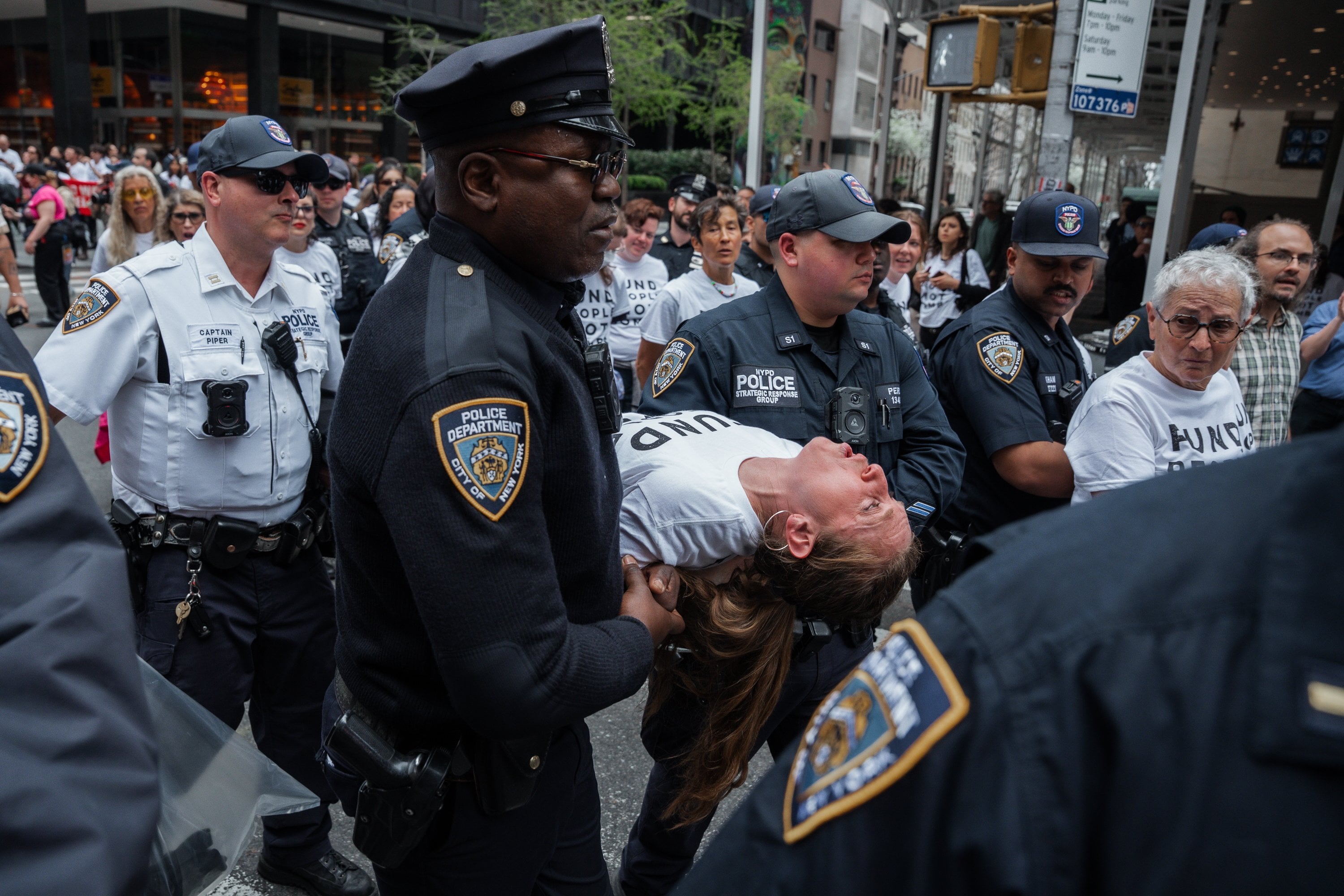 New York police officers carry a person after making an arrest during a protest against the war in the Middle East outside the offices of US Senator Chuck Schumer in New York on Monday. Photo: EPA