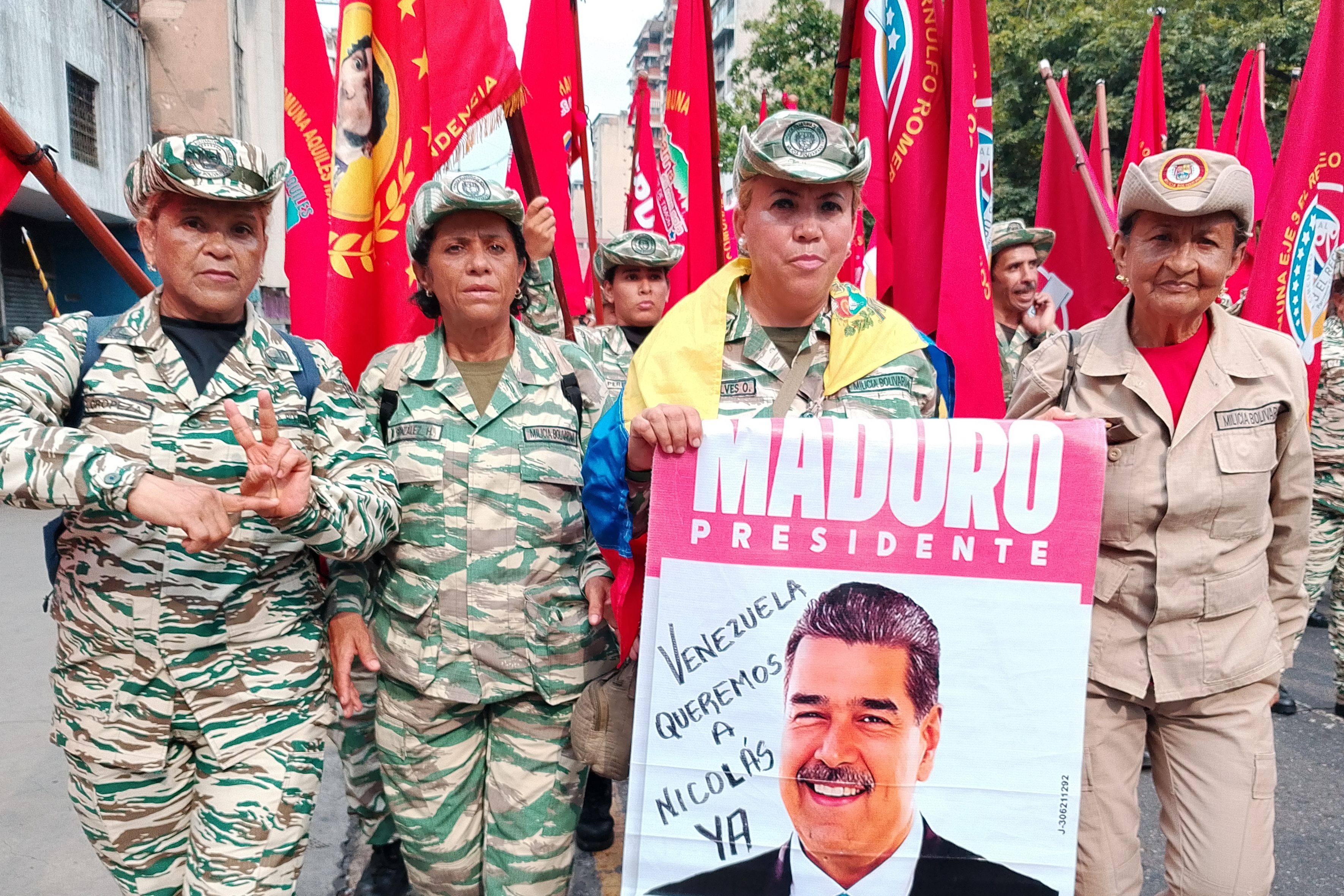 People taking part in a parade in central Caracas marking National Dignity Day hold a sign that says Venezuela wants Nicolas, referring to the country’s former leader who was captured by the US in January 2026. Photo: dpa