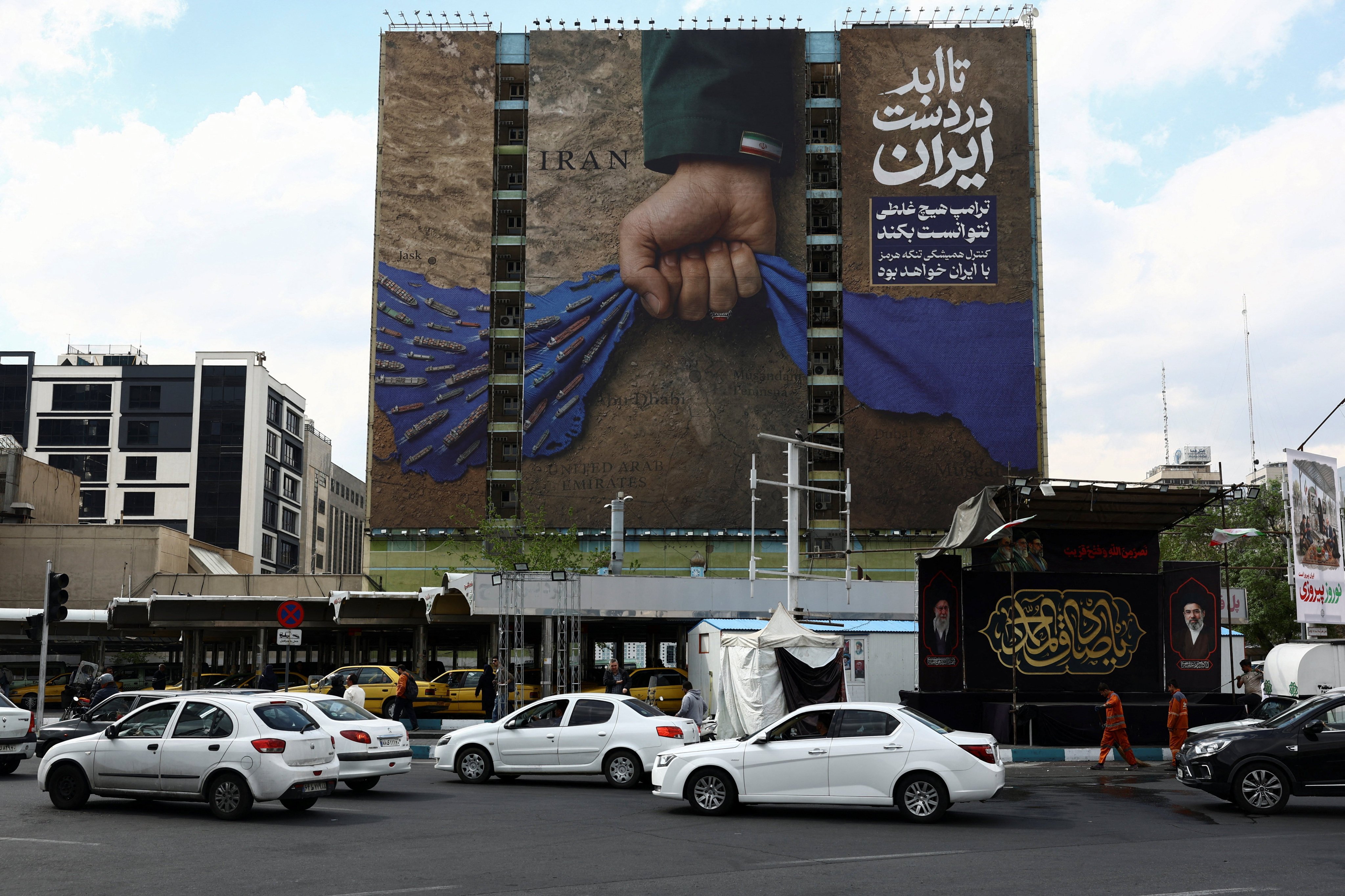 A billboard with a graphic design about the Strait of Hormuz on a building in Tehran, Iran, April 13, 2026. Photo: WANA via REUTERS