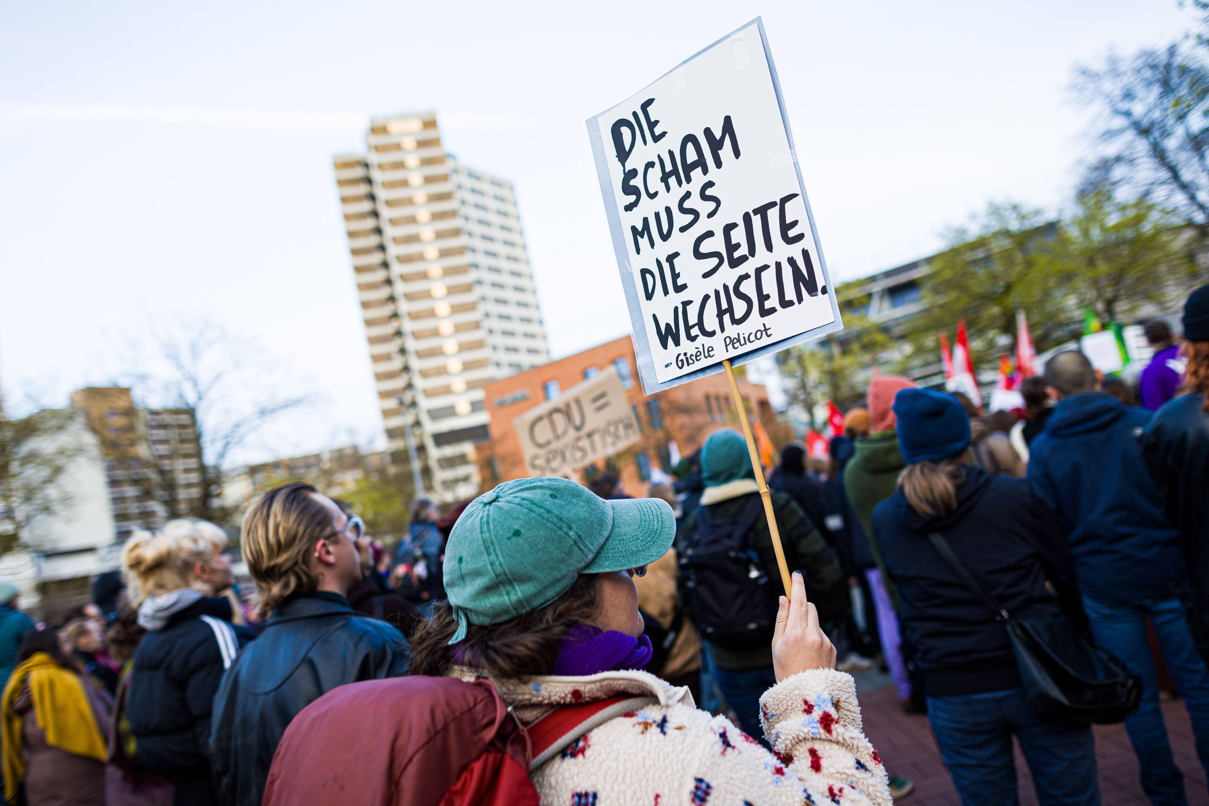 A protester at a rally against sexual violence in Hanover, Germany, in March holds a sign with the Gisele Pelicot quote “shame must change sides”. Photo: dpa