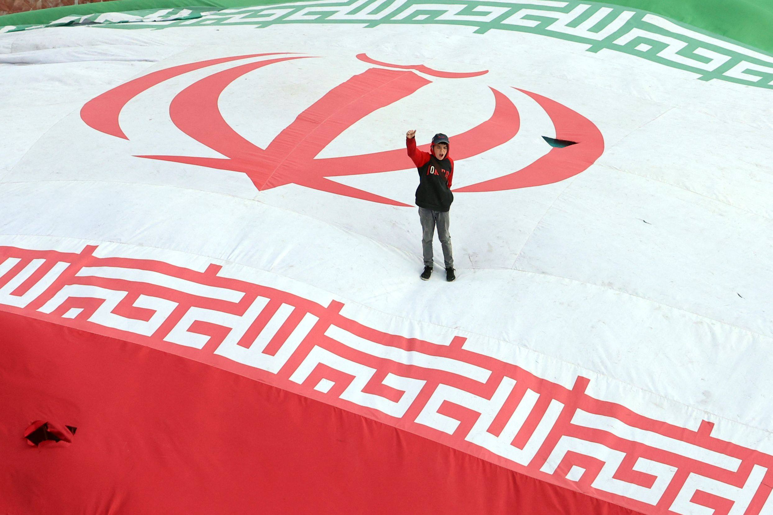 A boy in Tehran raises his fist during the funeral of Alireza Tangsiri, commander of the IRGC Navy, and others killed in recent US-Israeli strikes. Photo: AFP