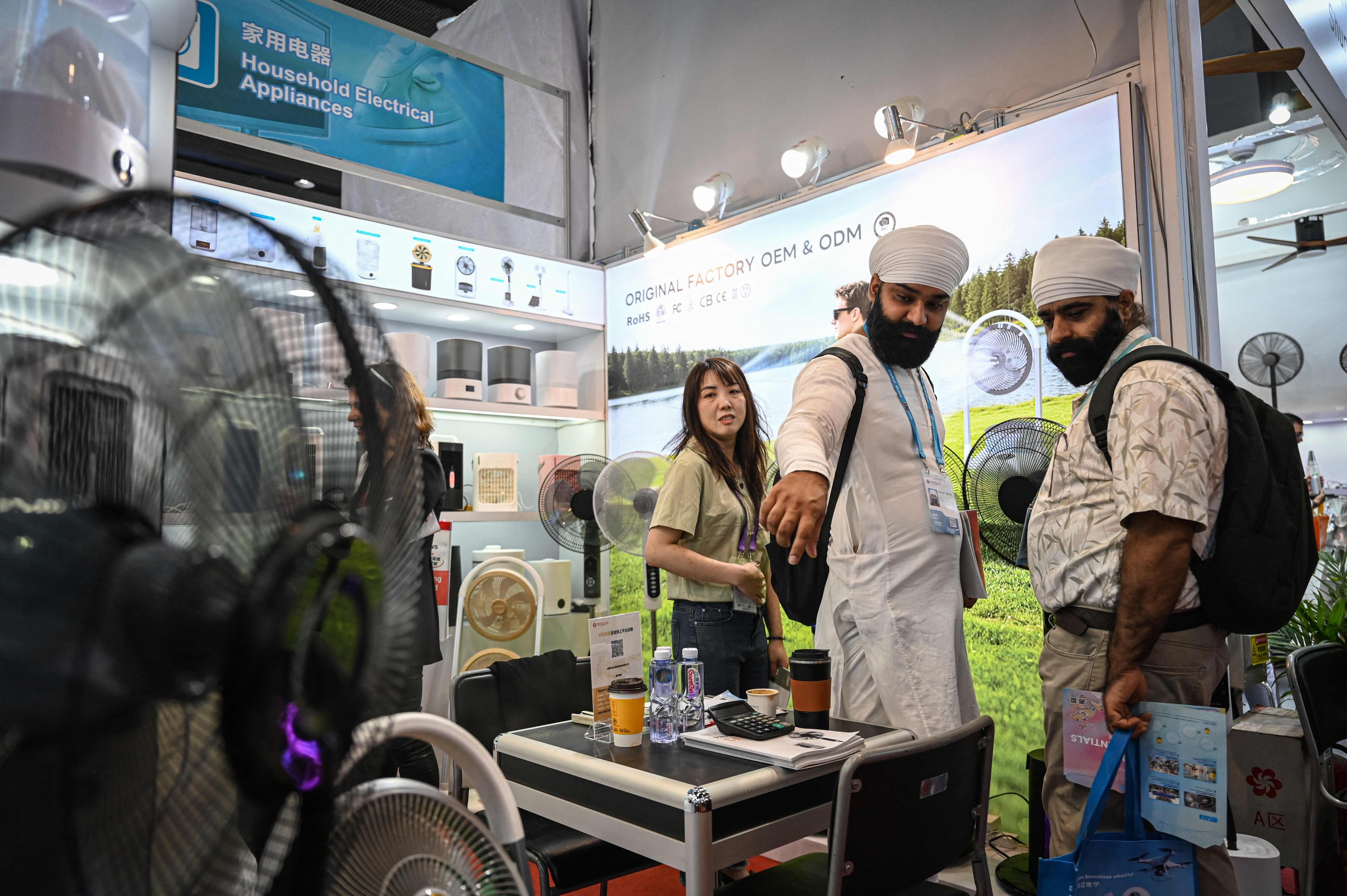 Buyers browse household electrical appliances at the 139th session of the China Import and Export Fair, also known as the Canton Fair, in Guangdong province on Wednesday. Photo: AFP