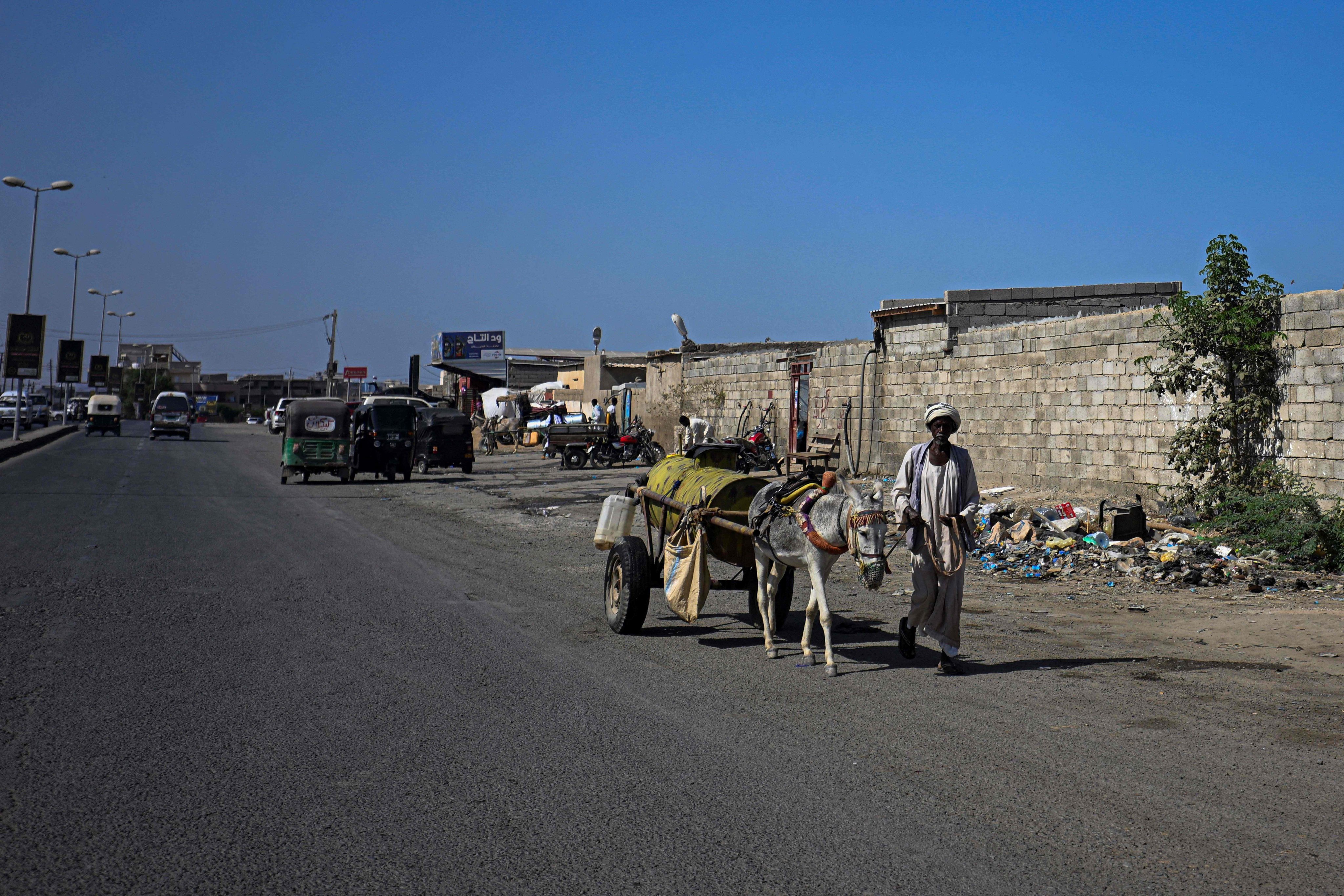 A Sudanese man pulls a donkey cart filled with water for sale in Port Sudan on Tuesday. Photo: AFP